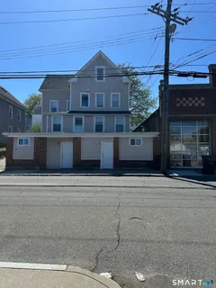 a front view of a building with a road