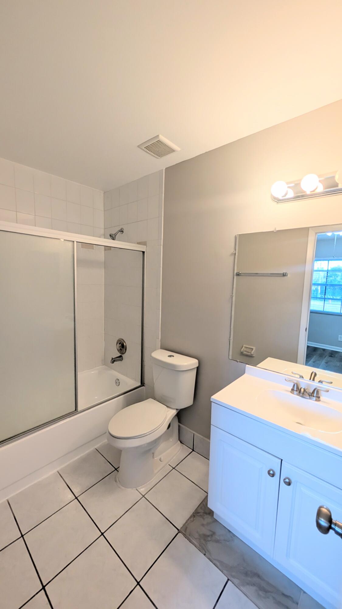 8341 Fairway Road Sunrise, FL 33351 - Photo 11 of 15 a bathroom with a toilet a sink and shower