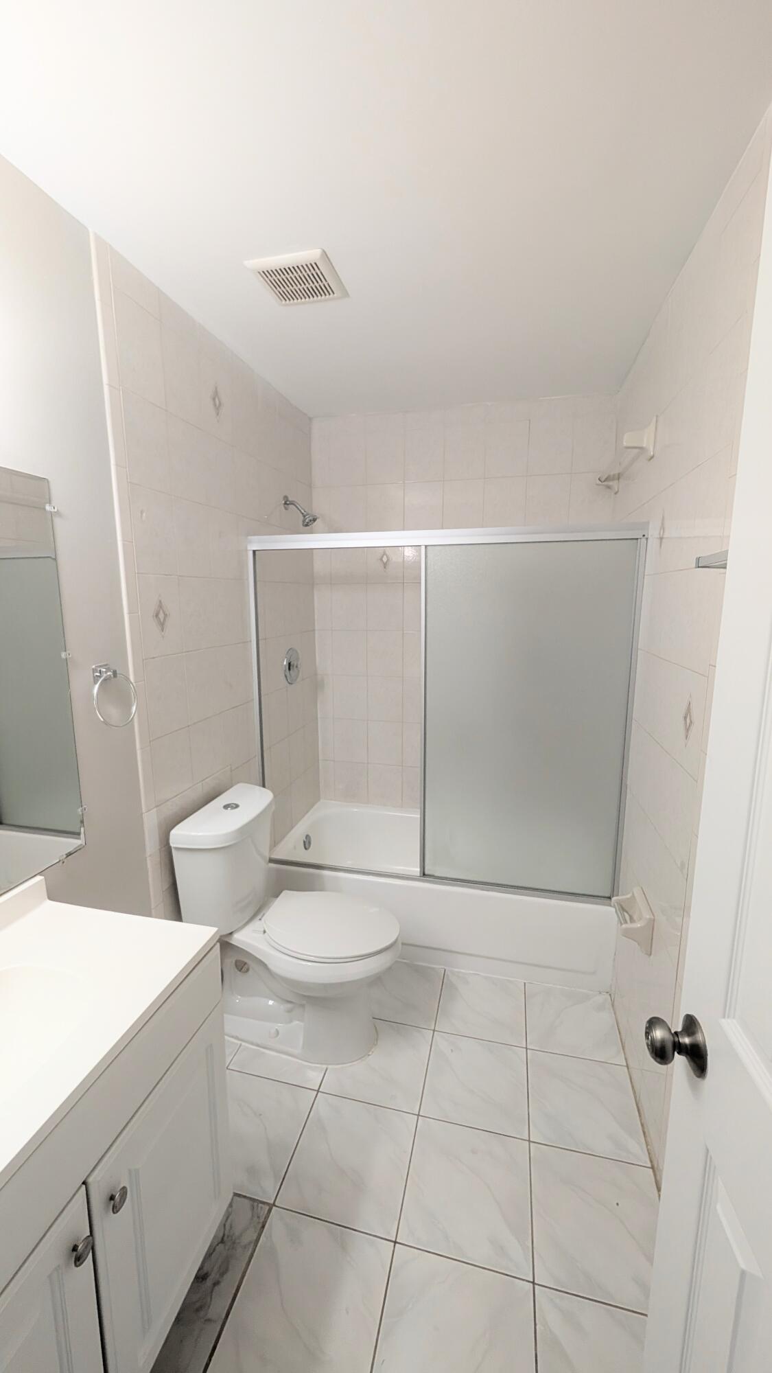 8341 Fairway Road Sunrise, FL 33351 - Photo 14 of 15 a bathroom with a sink a toilet and shower
