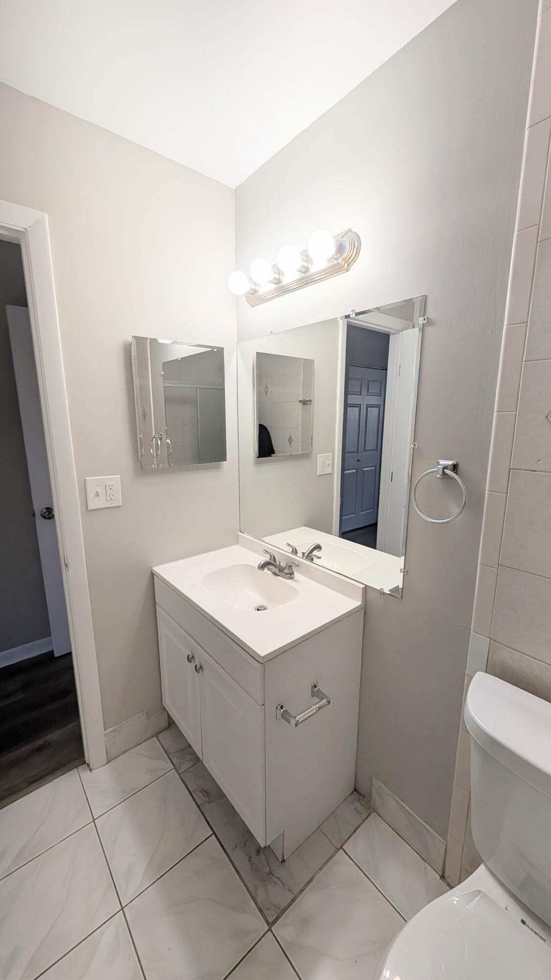 8341 Fairway Road Sunrise, FL 33351 - Photo 15 of 15 a bathroom with a sink and mirror