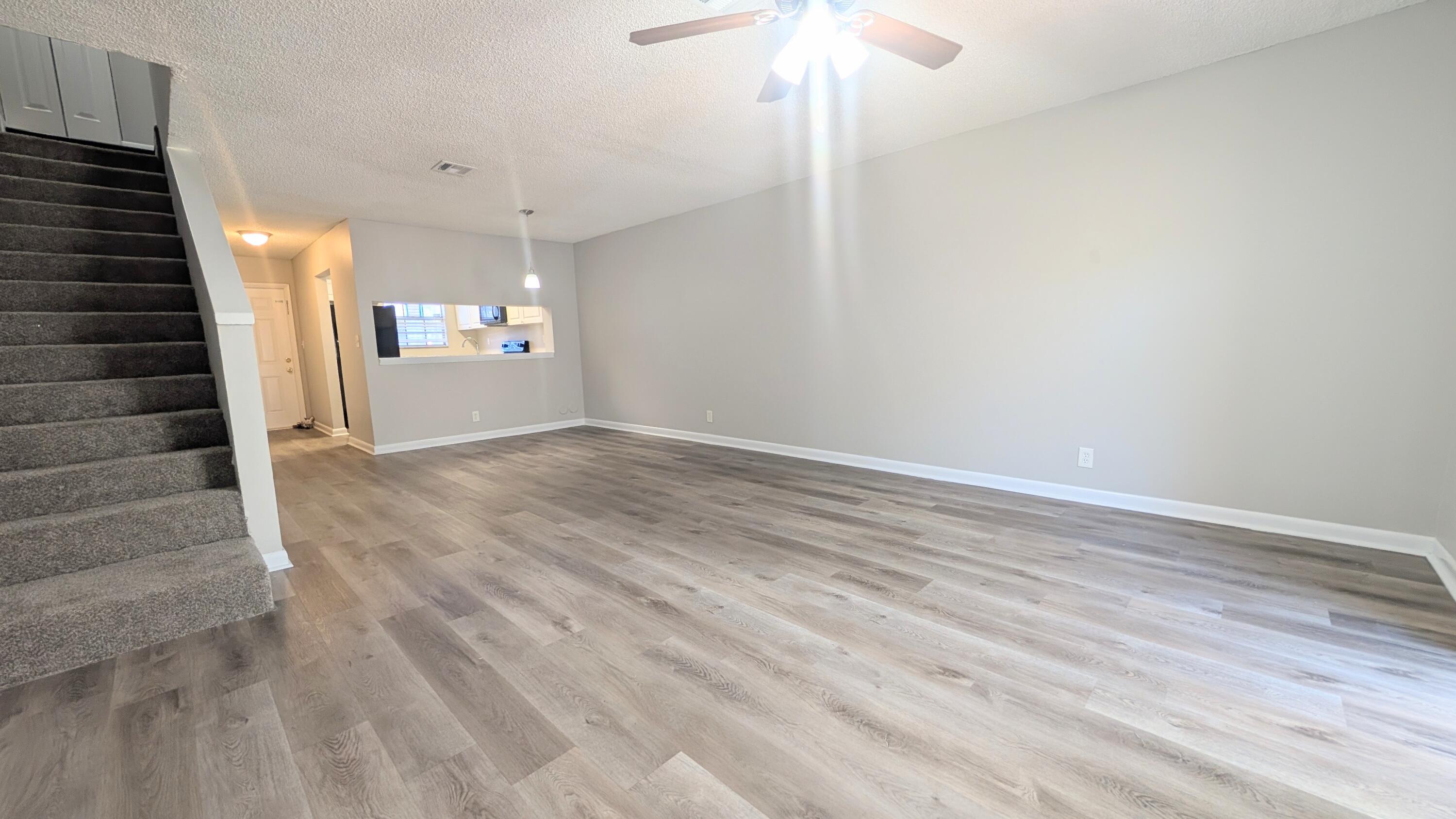 8341 Fairway Road Sunrise, FL 33351 - Photo 8 of 15 a view of entryway and hall with wooden floor