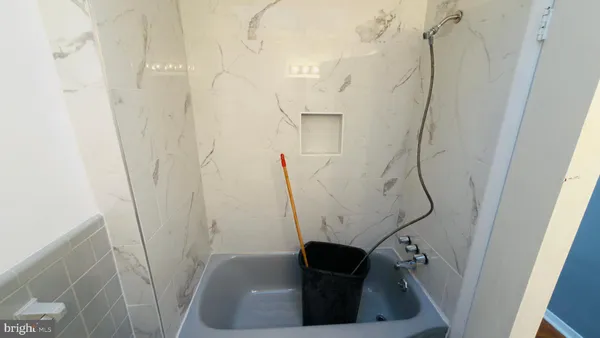 a white toilet sitting next to a bathroom sink