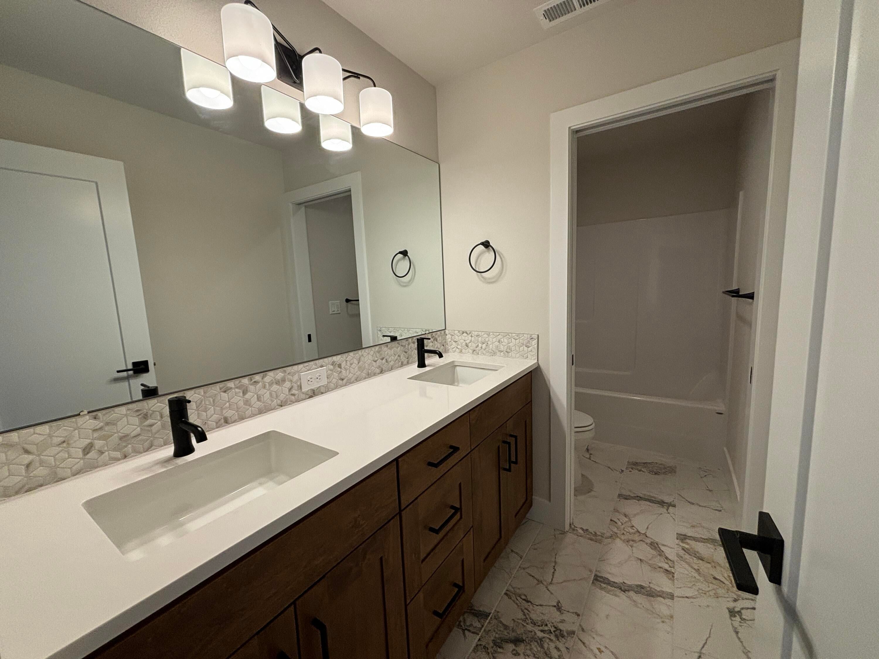 63337 O. B. Riley Road, Unit LOT 15 Bend, OR 97703 - Photo 15 of 27 Guest bathroom