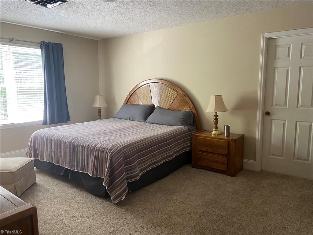 1719 Neelley Road Pleasant Garden, NC 27313 - Photo 23 of 35 Upstairs Bedroom 2. 16'10"x12'11"