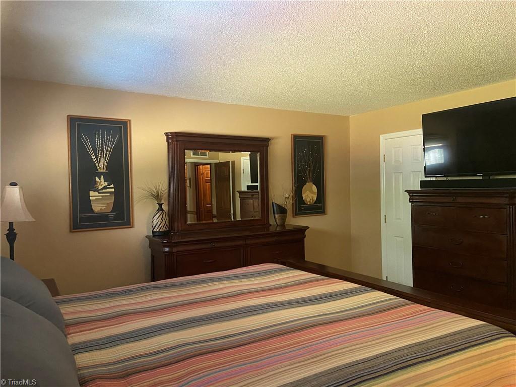 1719 Neelley Road Pleasant Garden, NC 27313 - Photo 4 of 35 Owners Suite. 14'x13'9"