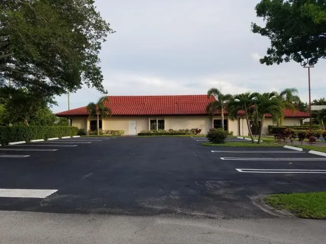 a view of a swimming pool with a yard