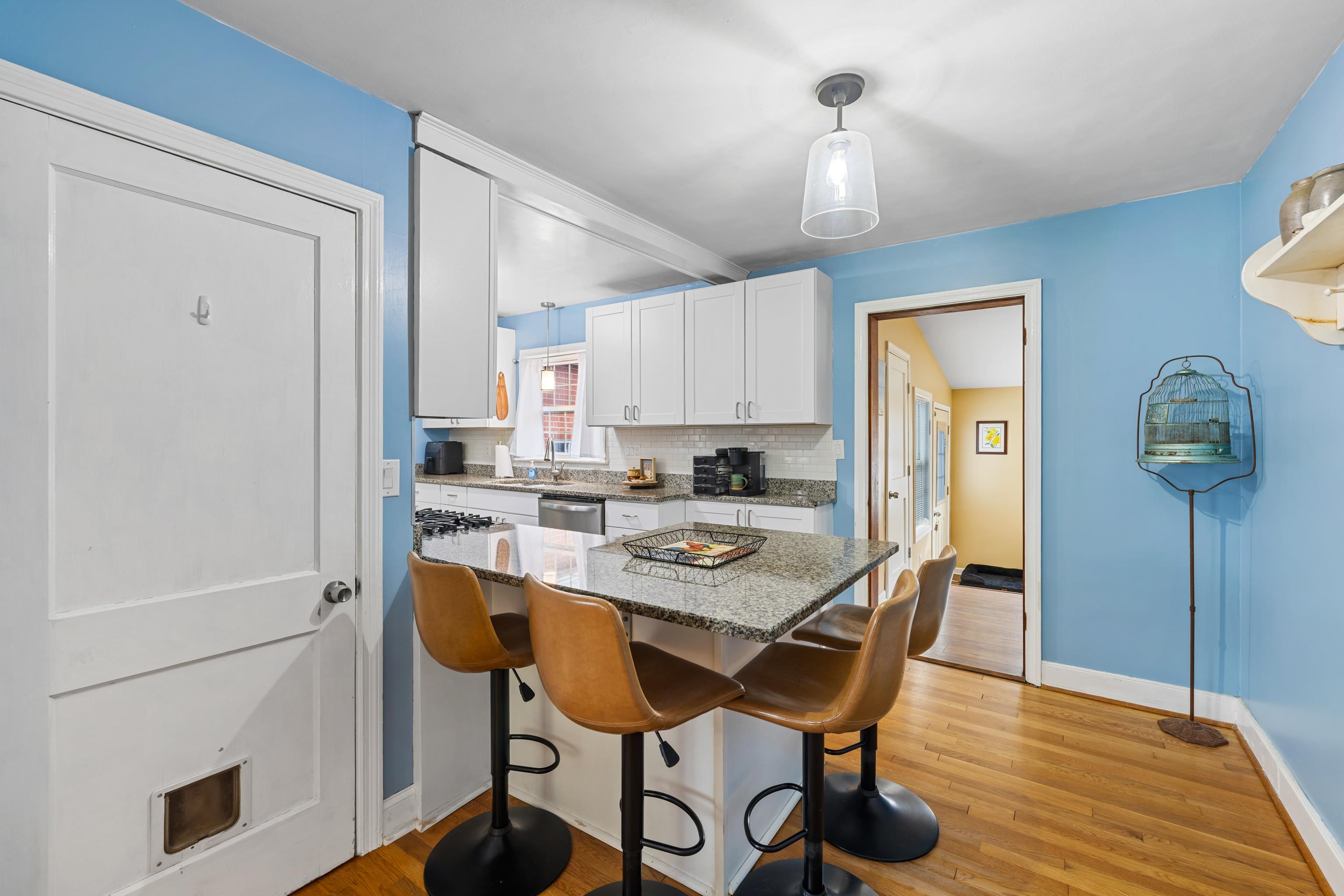 212 Alphin Avenue Waynesboro, VA 22980 - Photo 12 of 63 a view of a dining room with furniture window and wooden floor