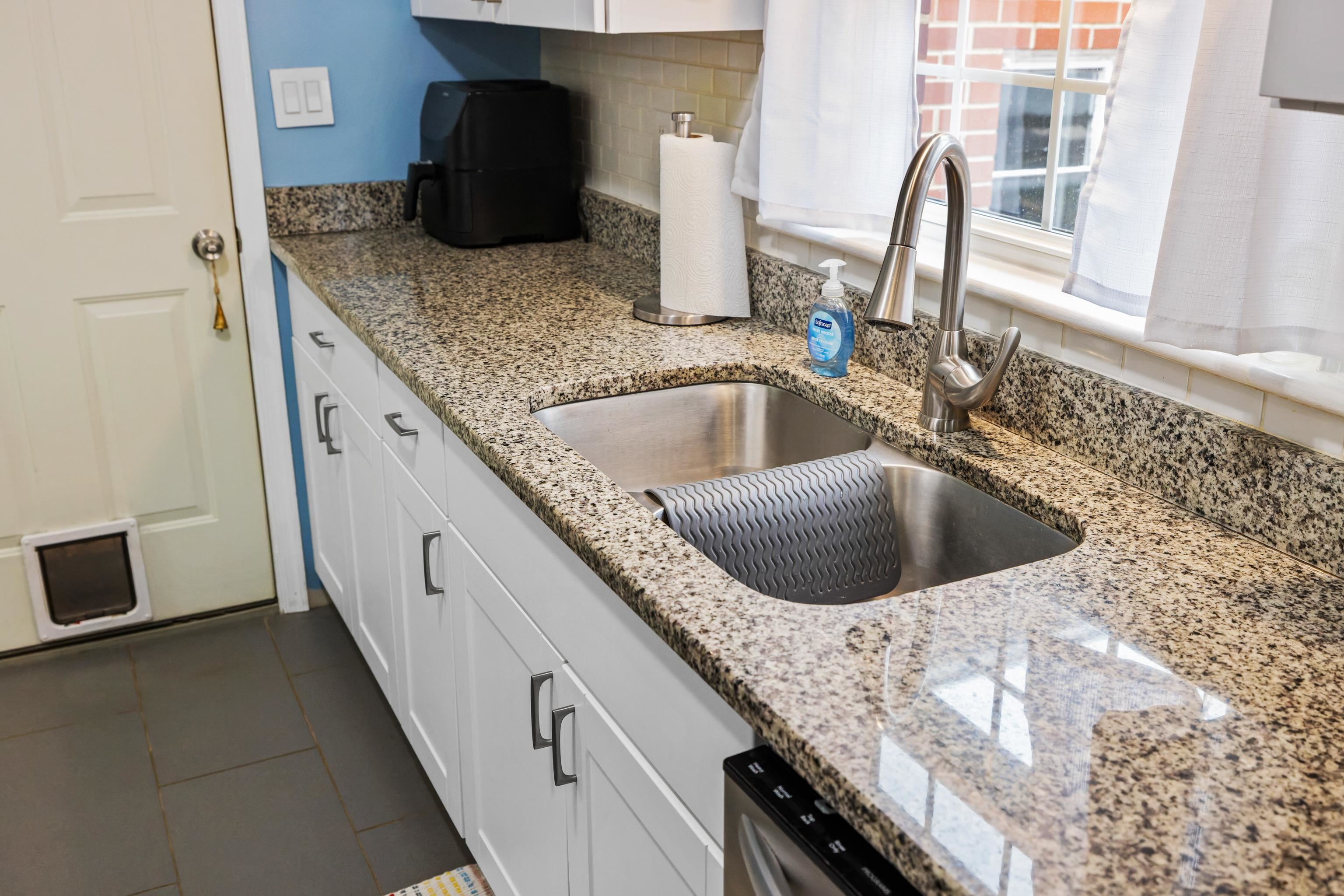 212 Alphin Avenue Waynesboro, VA 22980 - Photo 17 of 63 a kitchen with a granite countertop sink and a granite top