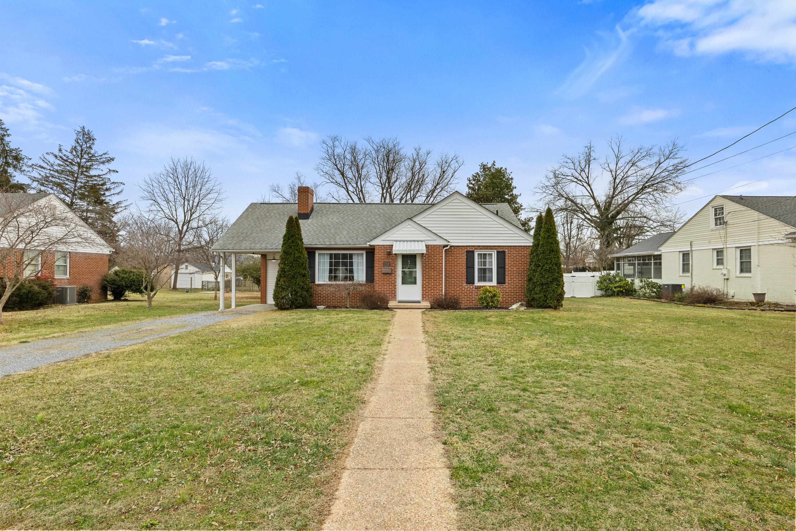 212 Alphin Avenue Waynesboro, VA 22980 - Photo 2 of 63 a front view of a house with a yard