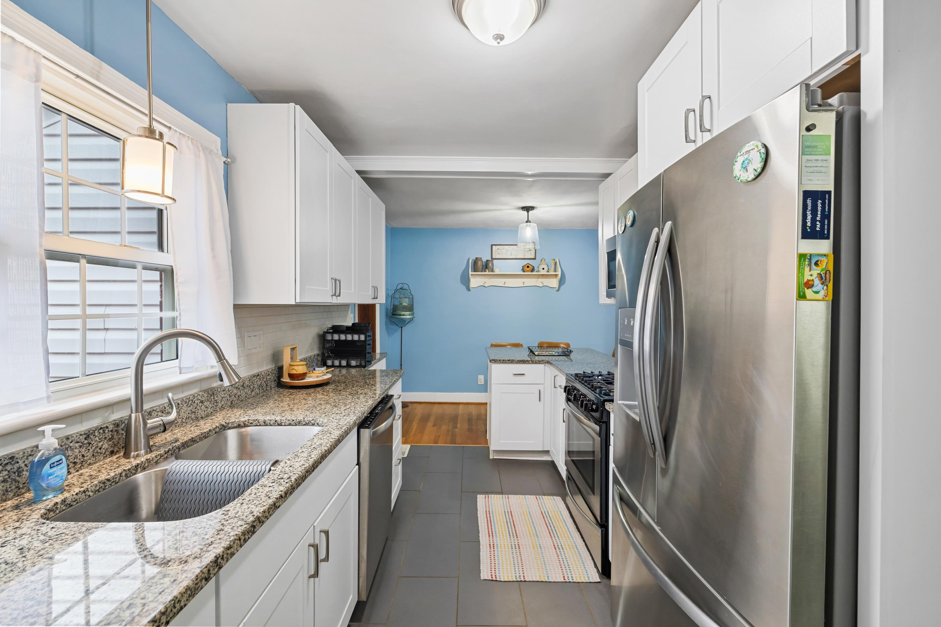 212 Alphin Avenue Waynesboro, VA 22980 - Photo 21 of 63 a kitchen with stainless steel appliances granite countertop a sink stove and refrigerator