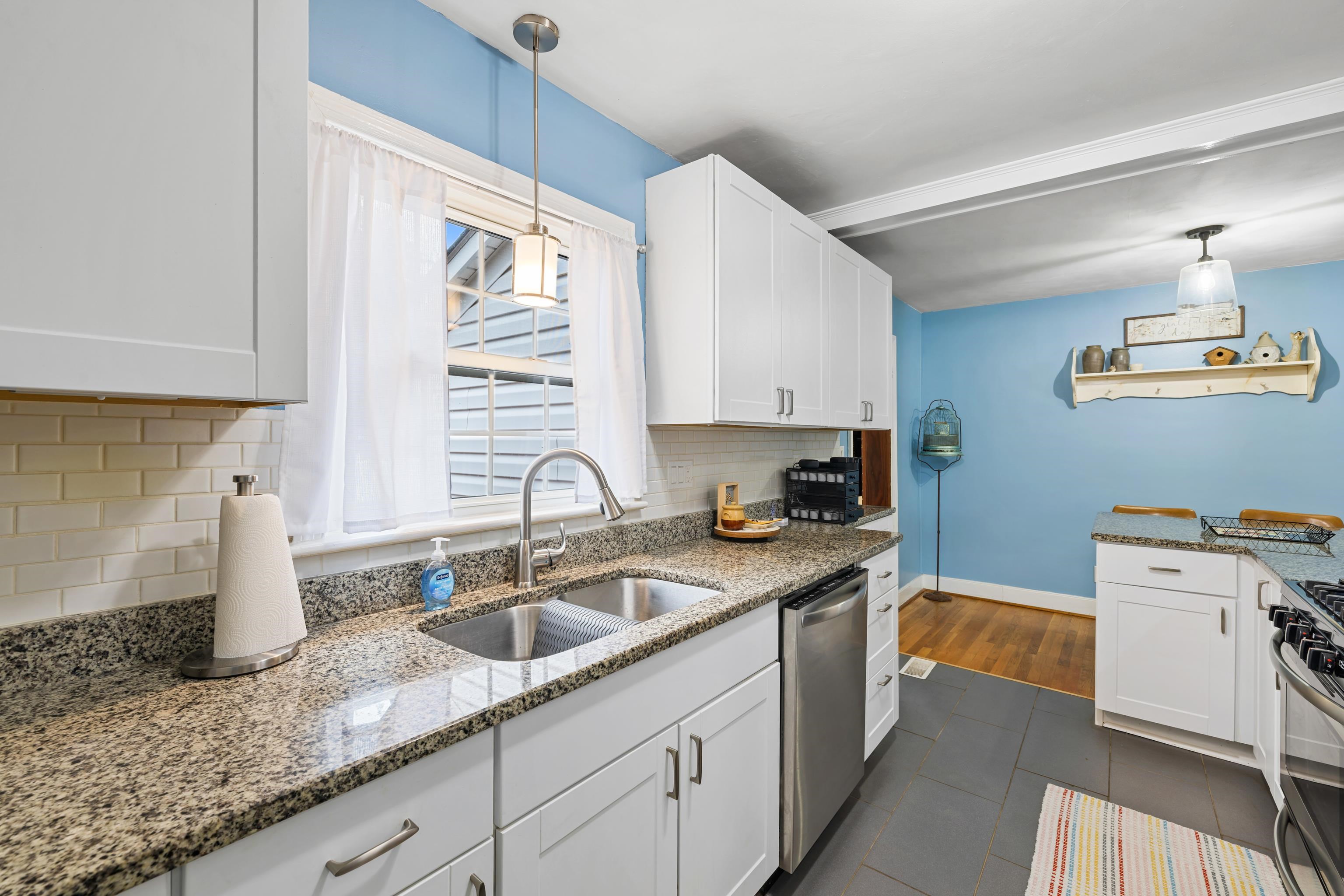 212 Alphin Avenue Waynesboro, VA 22980 - Photo 24 of 63 a kitchen that has a sink and a stove