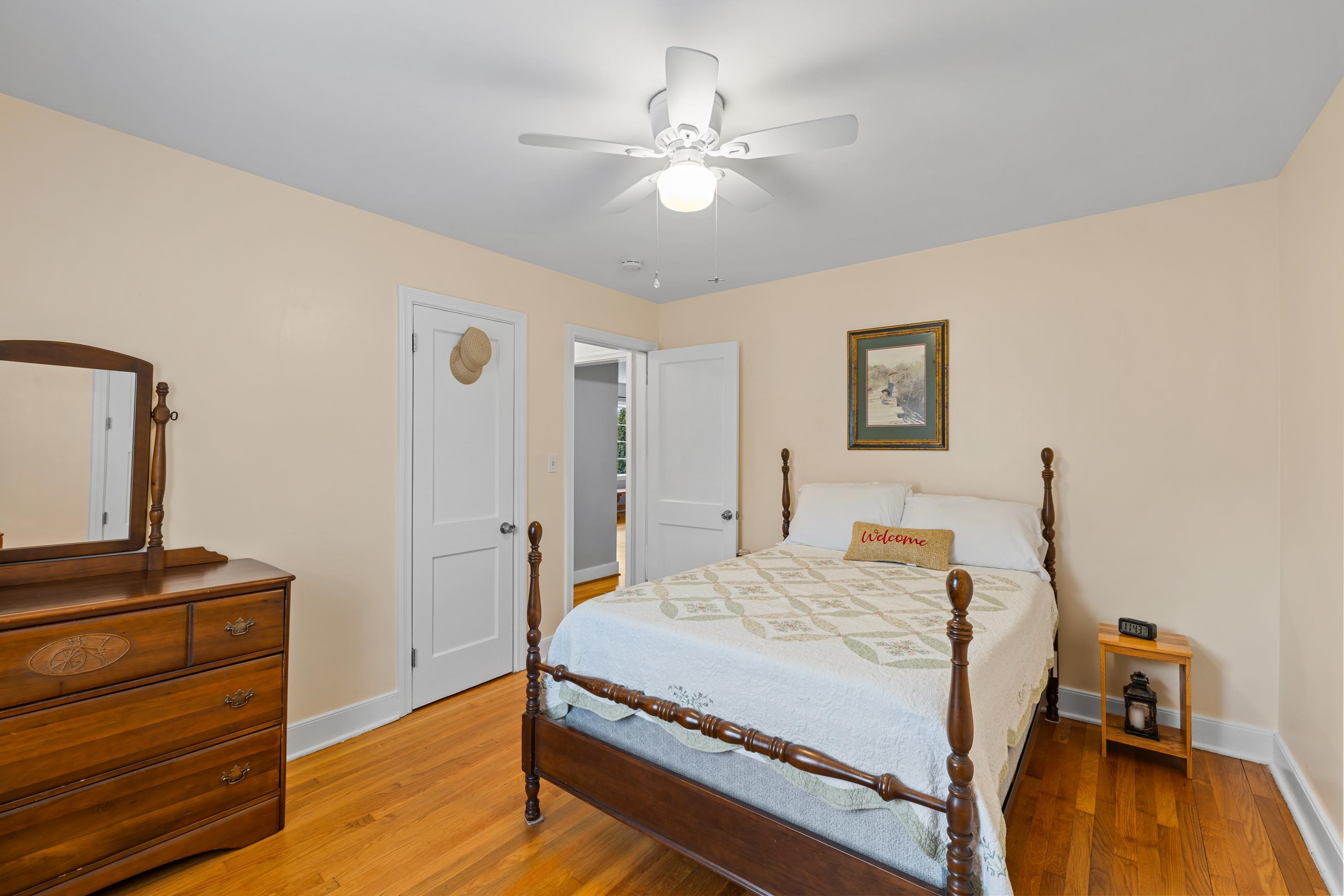 212 Alphin Avenue Waynesboro, VA 22980 - Photo 27 of 63 a bedroom with a bed and a dresser with wooden floor