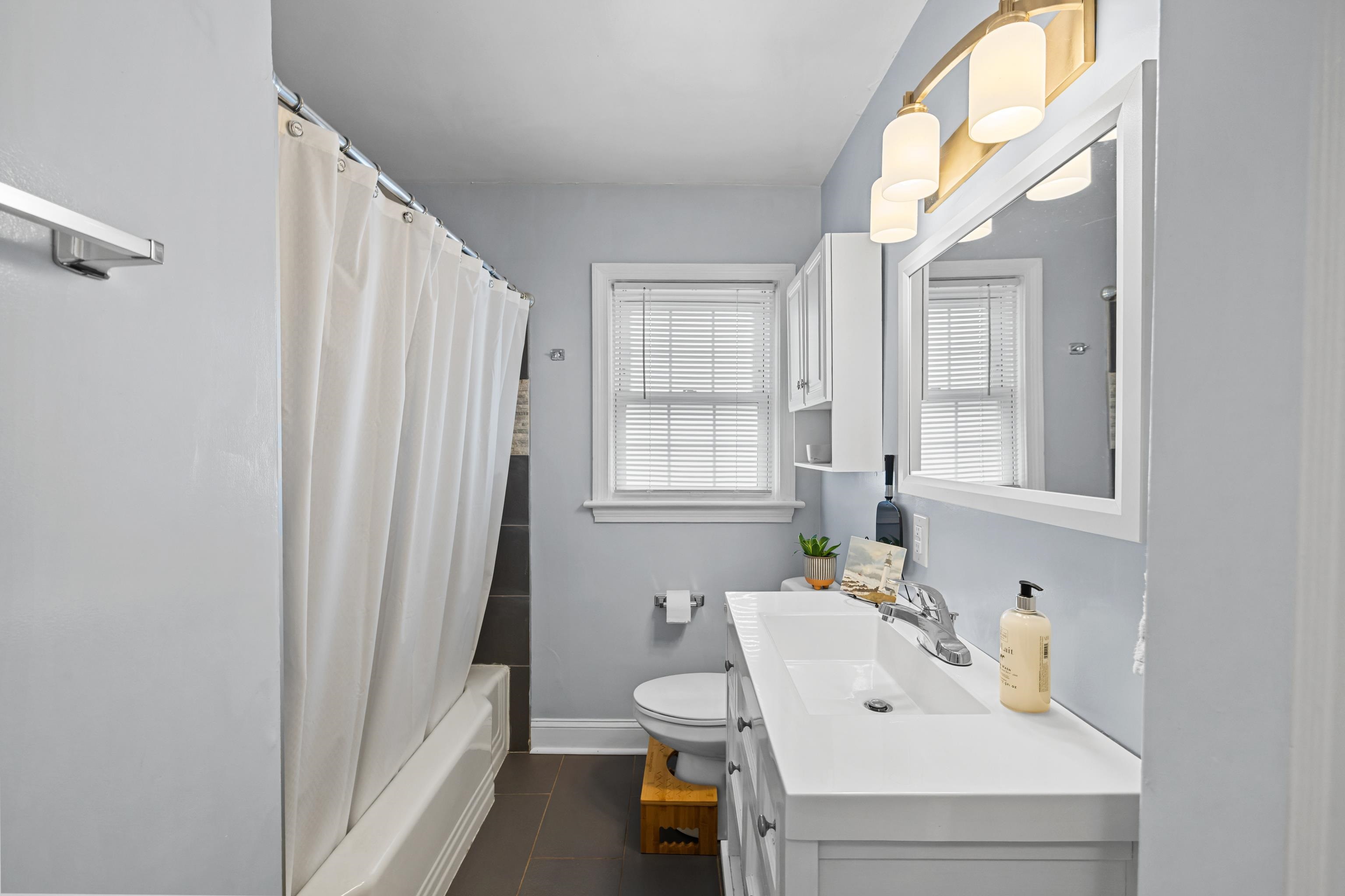 212 Alphin Avenue Waynesboro, VA 22980 - Photo 28 of 63 a bathroom with a sink and a mirror