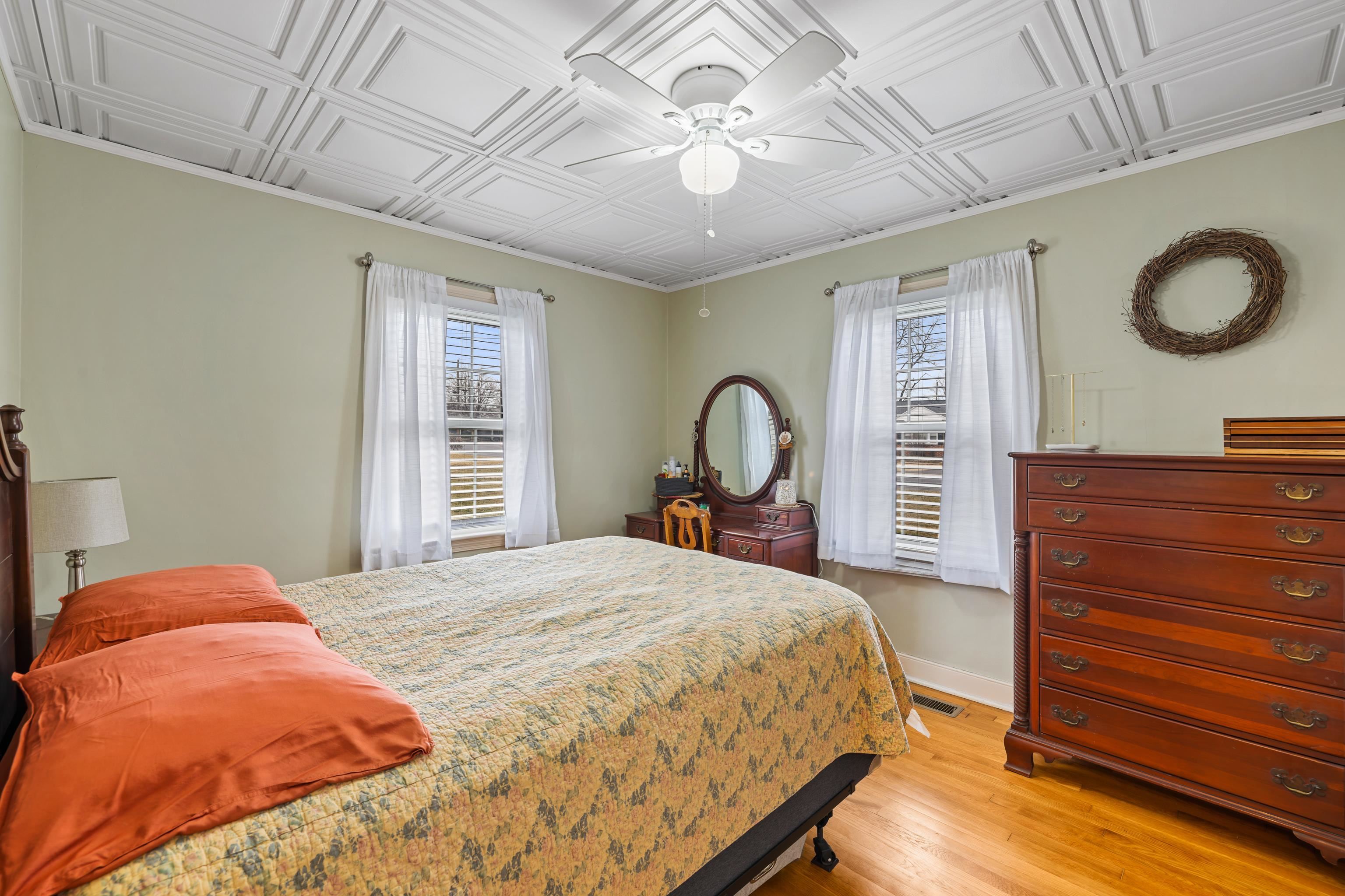 212 Alphin Avenue Waynesboro, VA 22980 - Photo 33 of 63 a bedroom with a bed and a chandelier