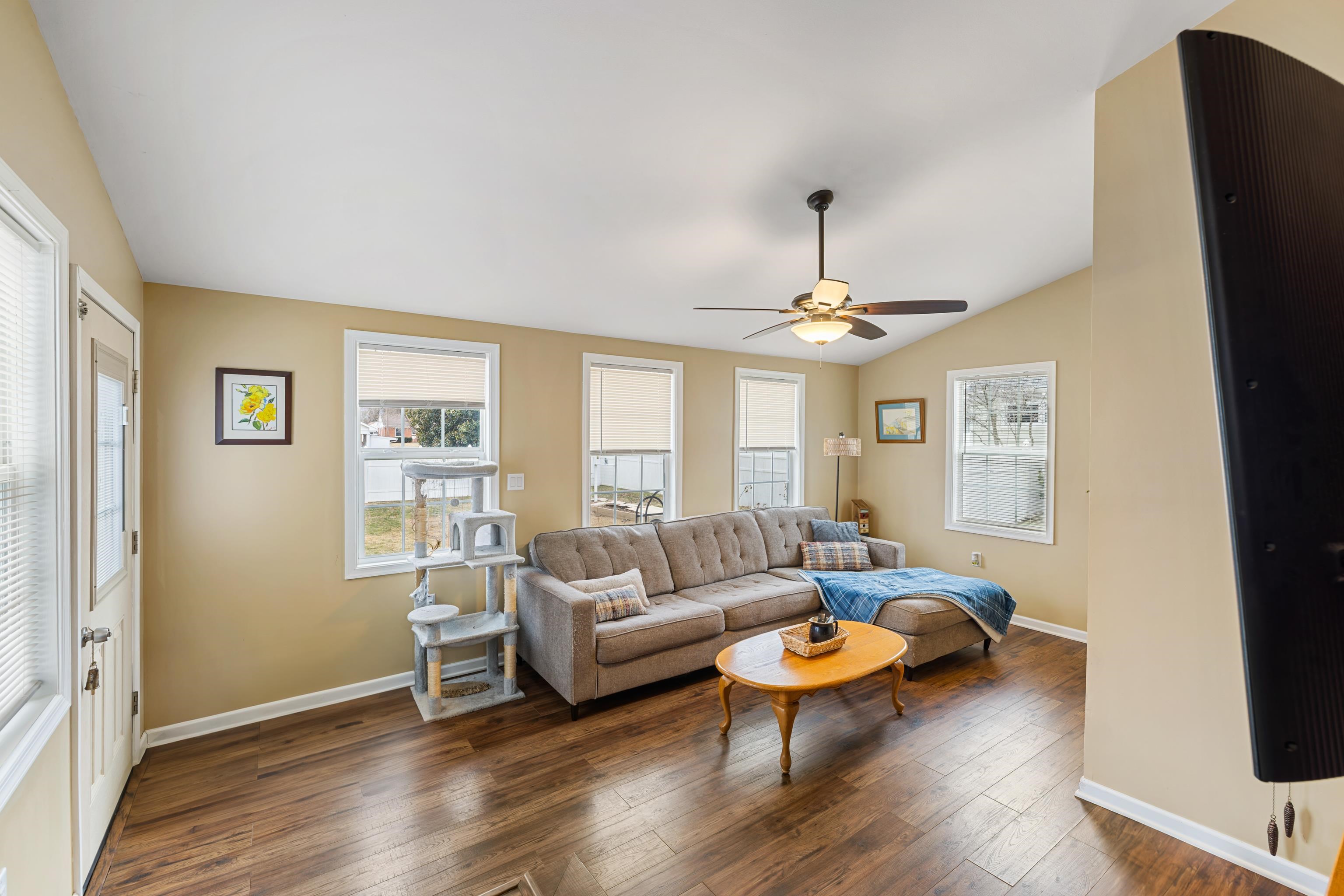 212 Alphin Avenue Waynesboro, VA 22980 - Photo 41 of 63 a living room with furniture a ceiling fan and a window