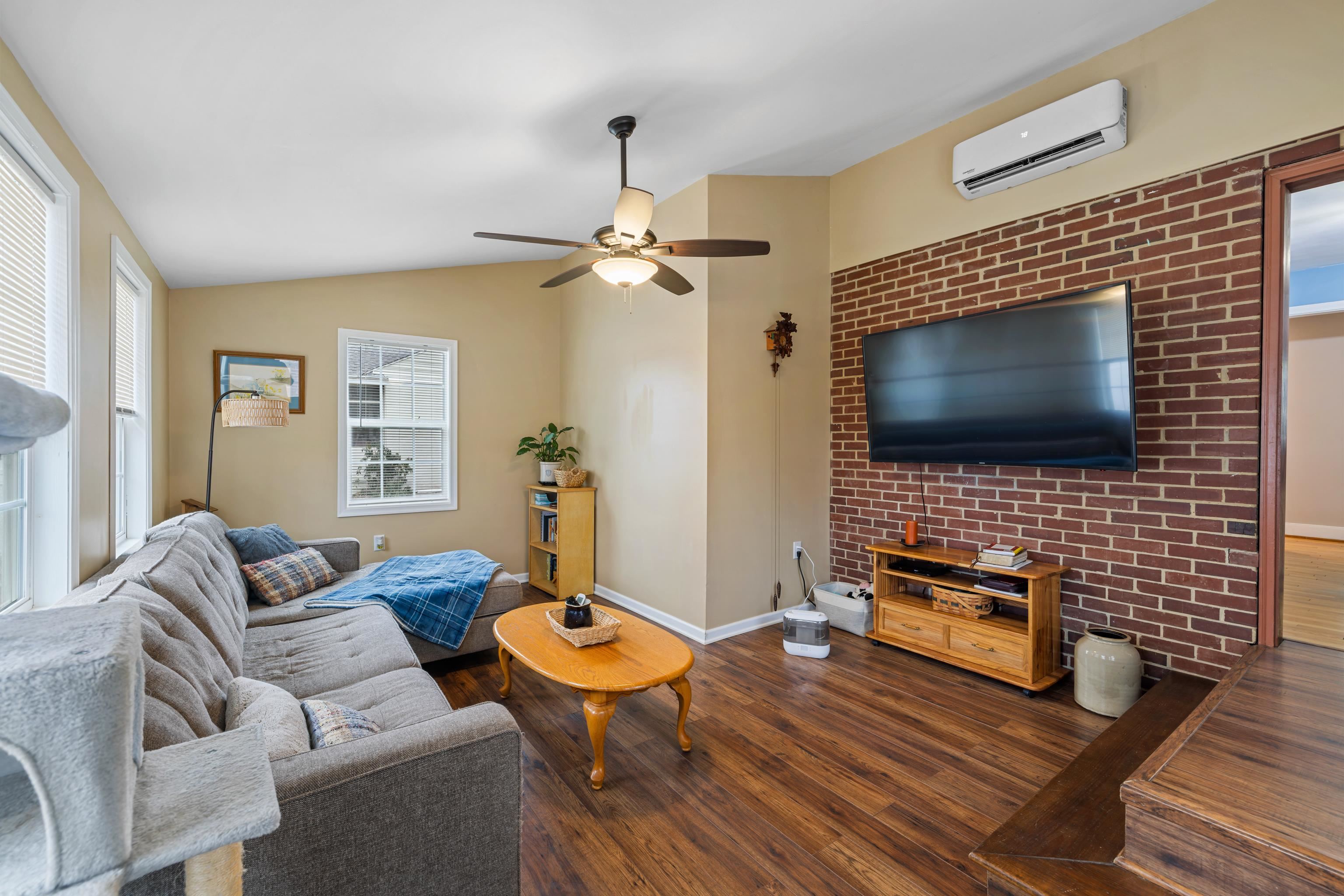 212 Alphin Avenue Waynesboro, VA 22980 - Photo 42 of 63 a living room with furniture and a flat screen tv
