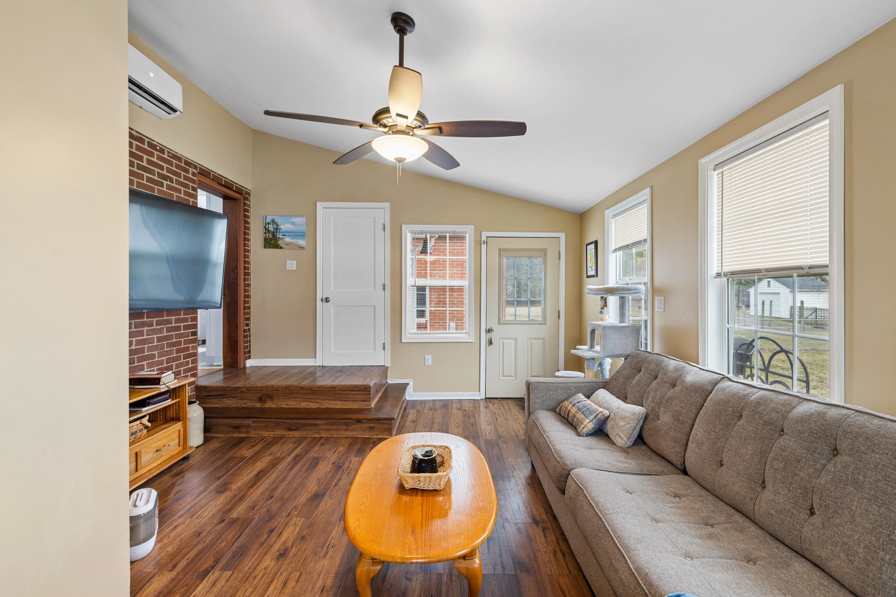212 Alphin Avenue Waynesboro, VA 22980 - Photo 44 of 63 a living room with furniture a ceiling fan and a window