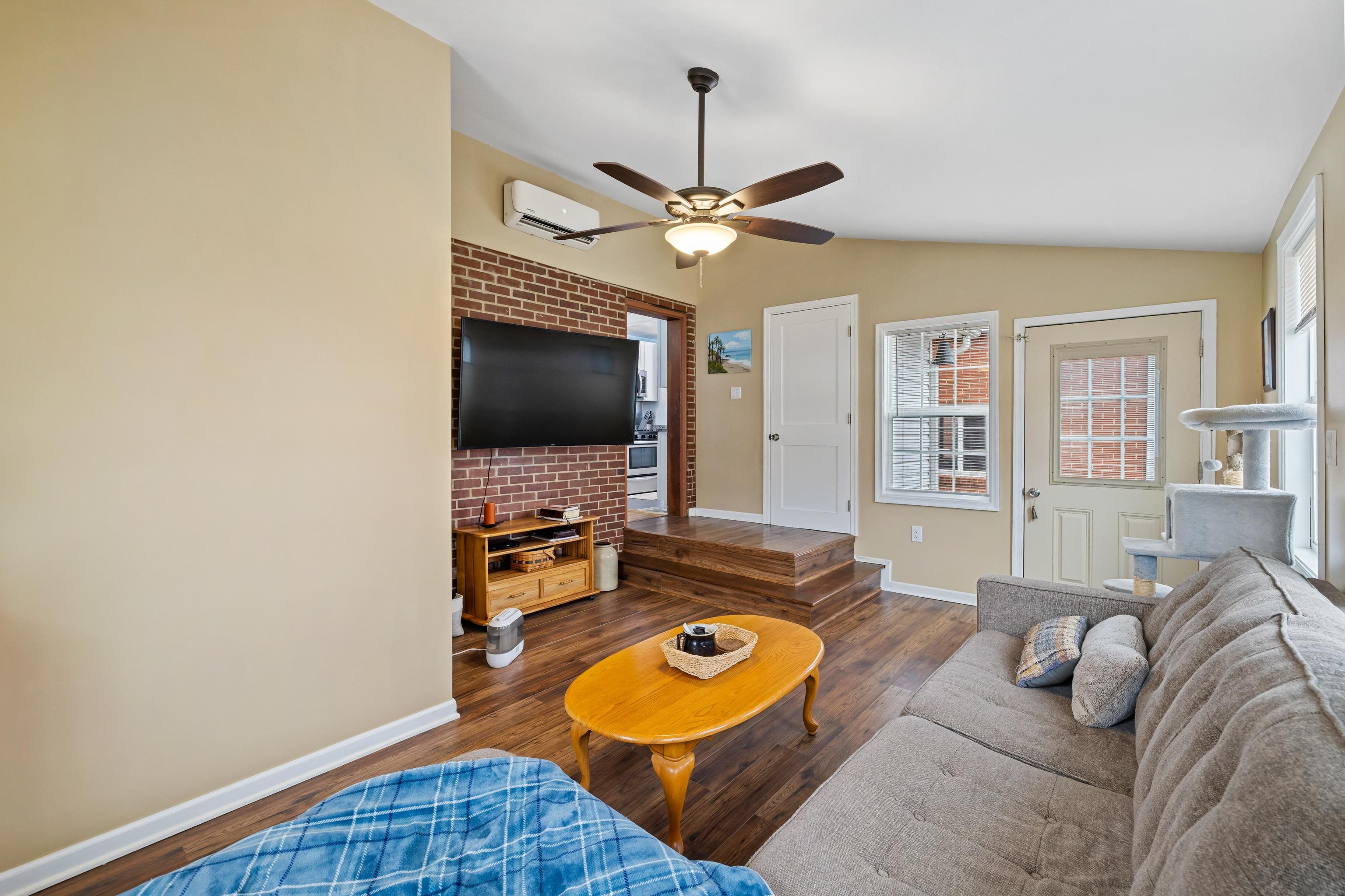 212 Alphin Avenue Waynesboro, VA 22980 - Photo 45 of 63 a living room with furniture and a flat screen tv