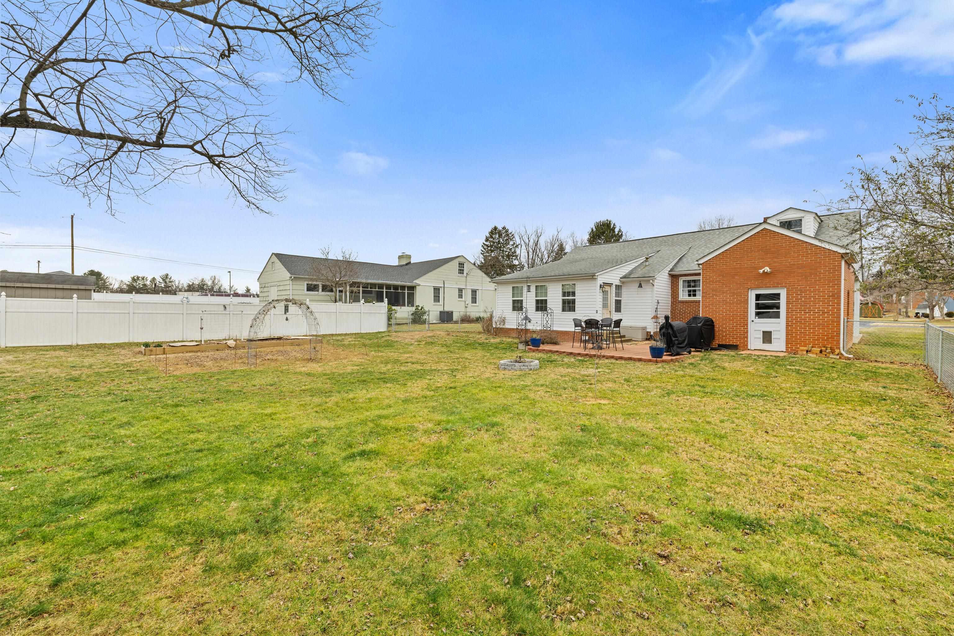 212 Alphin Avenue Waynesboro, VA 22980 - Photo 50 of 63 a view of a house with a big yard and large trees