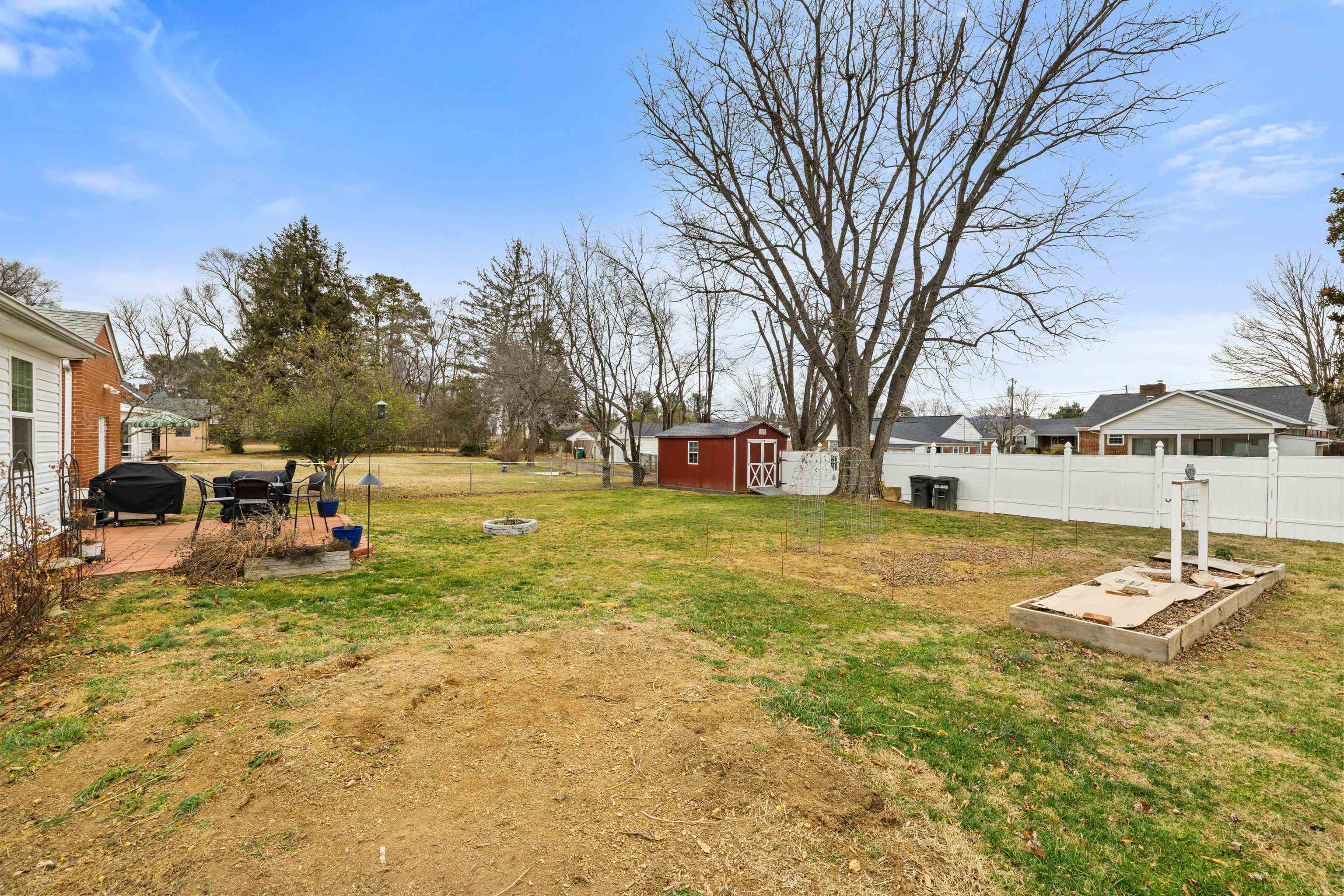 212 Alphin Avenue Waynesboro, VA 22980 - Photo 56 of 63 a backyard of a house with table and chairs