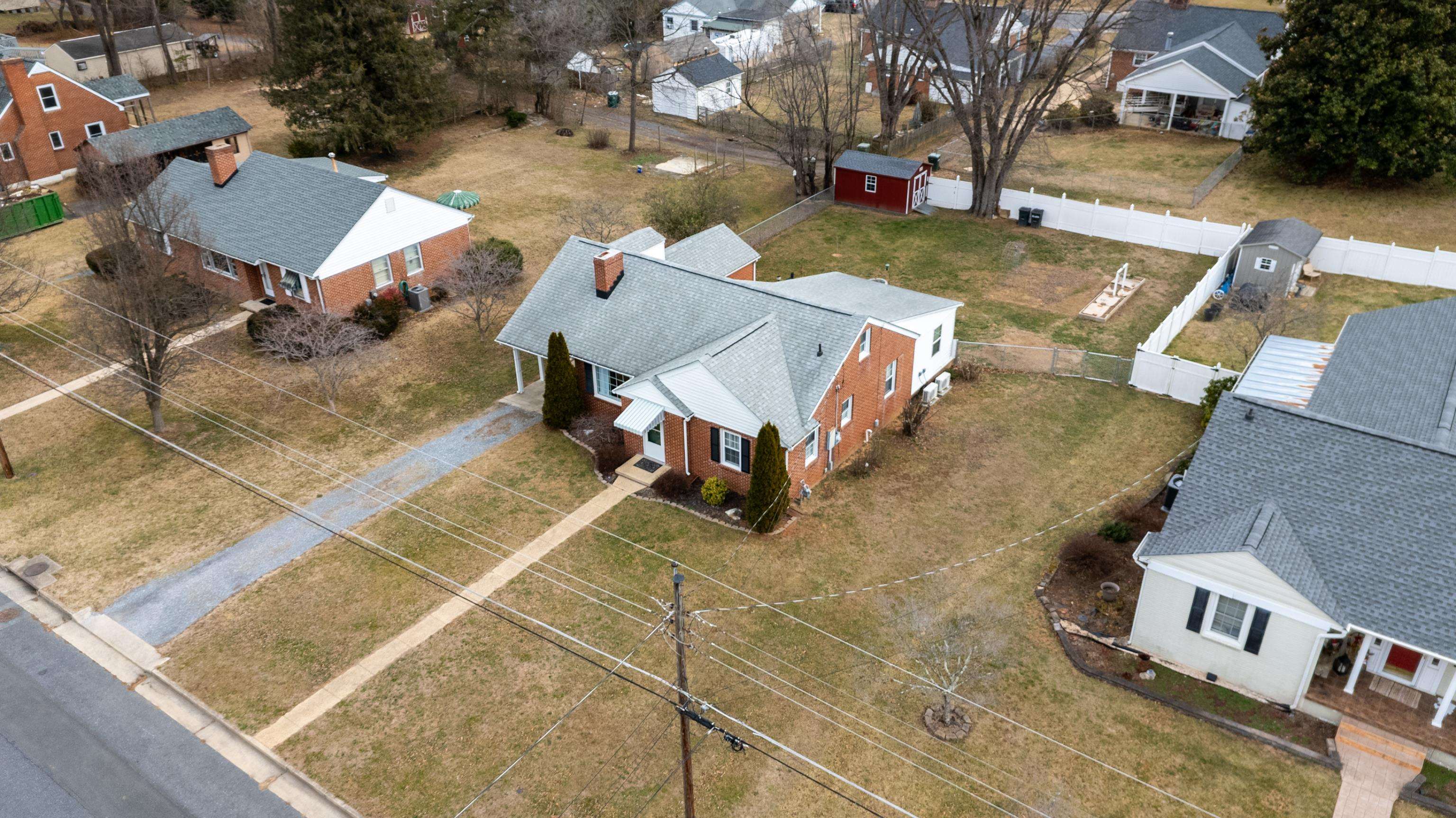212 Alphin Avenue Waynesboro, VA 22980 - Photo 57 of 63 an aerial view of a house with garden space and sitting area