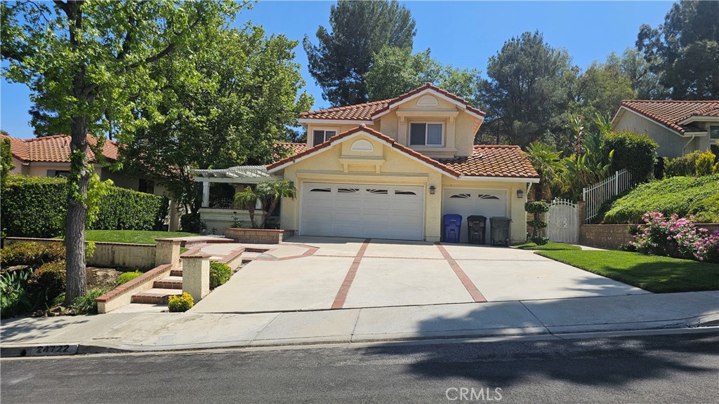 a front view of a house with garage