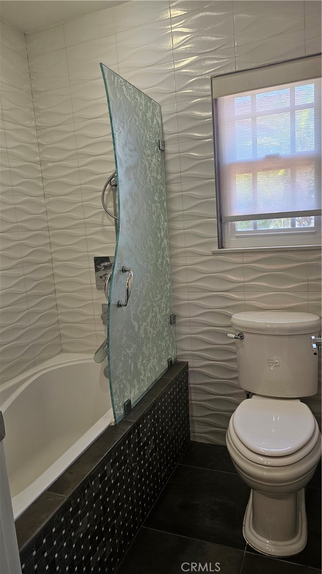 24722 Bracken Lane Stevenson Ranch, CA 91381 - Photo 21 of 36 a bathroom with a toilet and a shower