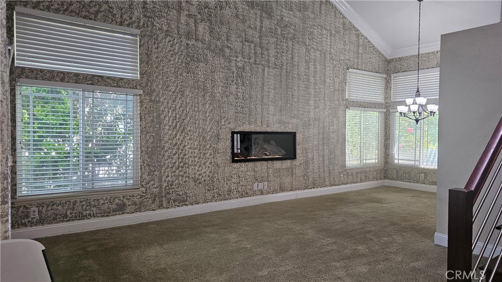 24722 Bracken Lane Stevenson Ranch, CA 91381 - Photo 23 of 36 a living room with furniture and a flat screen tv