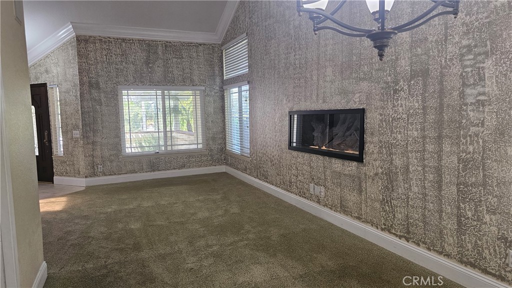 24722 Bracken Lane Stevenson Ranch, CA 91381 - Photo 26 of 36 a view of a livingroom with a fireplace