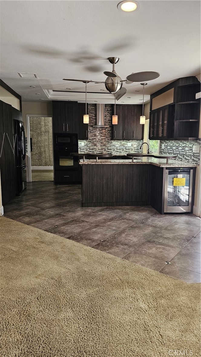 24722 Bracken Lane Stevenson Ranch, CA 91381 - Photo 10 of 36 a kitchen with stainless steel appliances kitchen island granite countertop a sink and cabinets