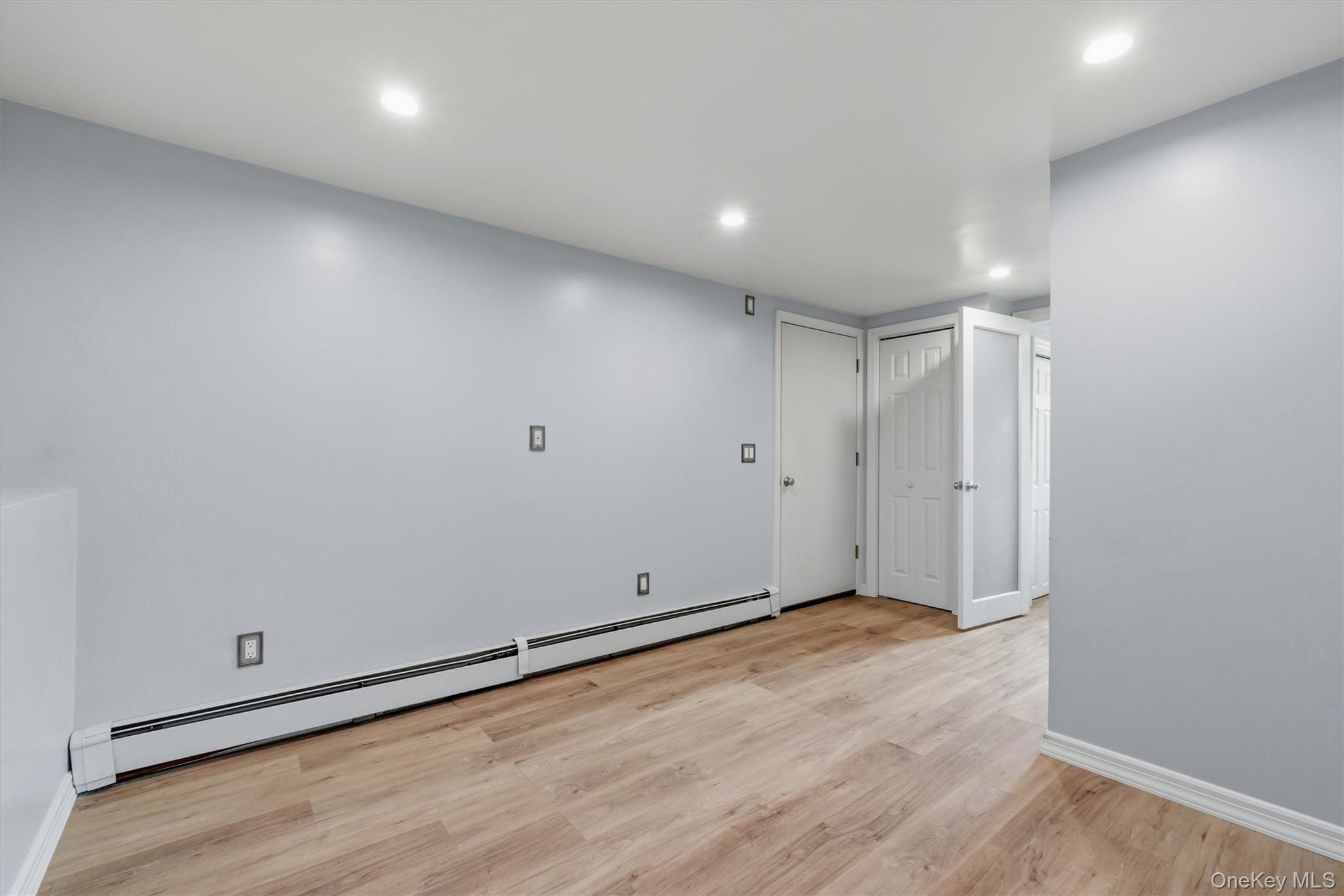 17 Ridge Road Cortlandt Manor, NY 10567 - Photo 25 of 38 Updated basement area has laminated flooring and high hats.