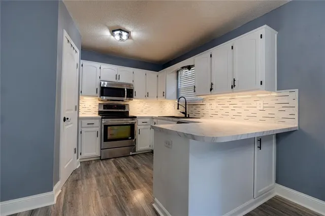 $315,000 | 123 South Darrowby Drive, Raymore, MO 64083