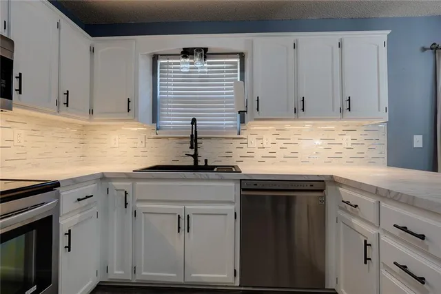 $315,000 | 123 South Darrowby Drive, Raymore, MO 64083