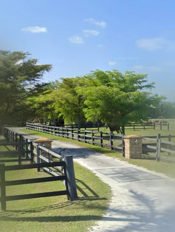 a view of a swimming pool with an outdoor seating and a ocean view
