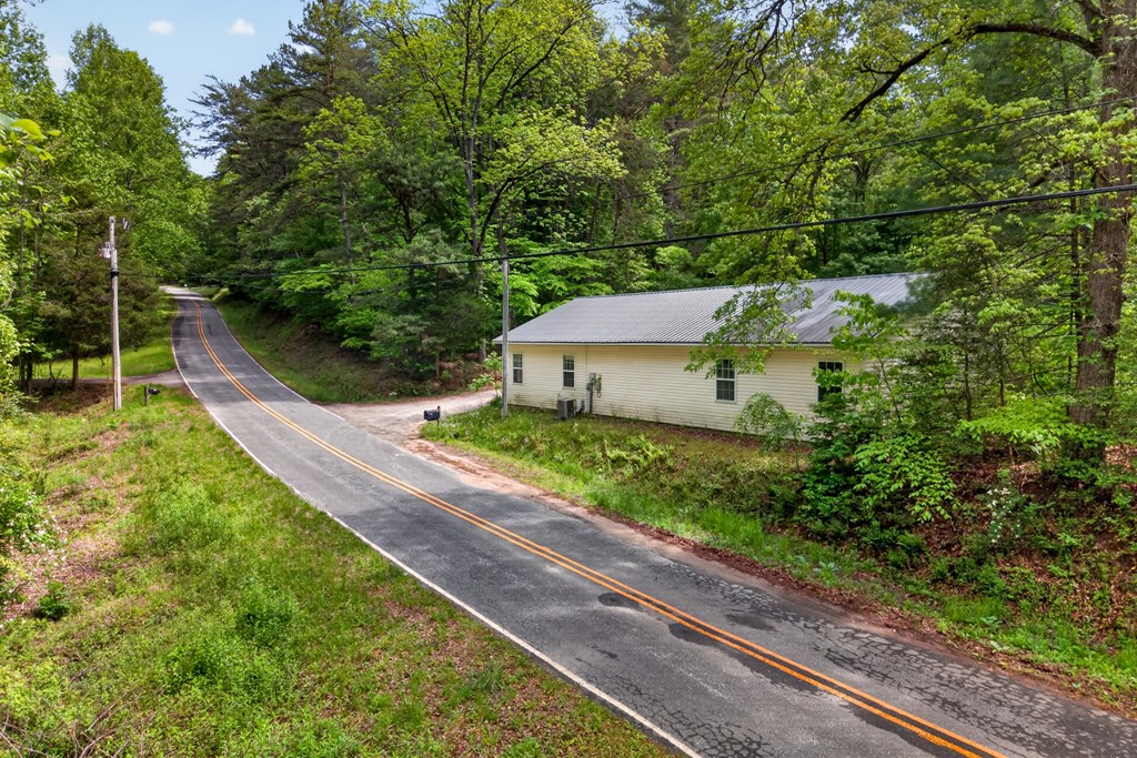 282 West Cherry Road Hayesville, NC 28904 - Photo 25 of 45 a view of a garden with a bench