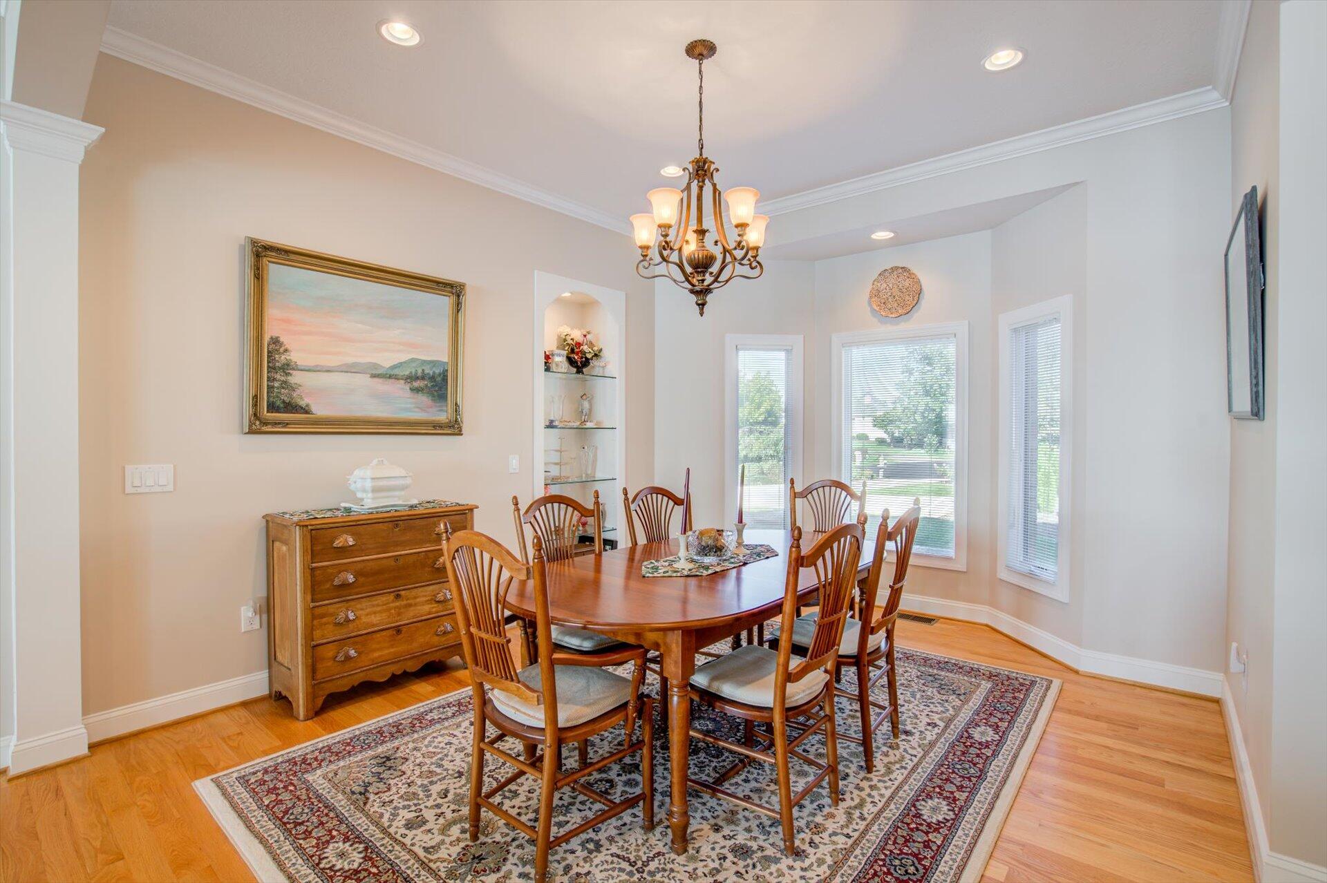 249 Pine Bay Drive Union Hall, VA 24176 - Photo 14 of 62 a view of a dining room with furniture window and wooden floor