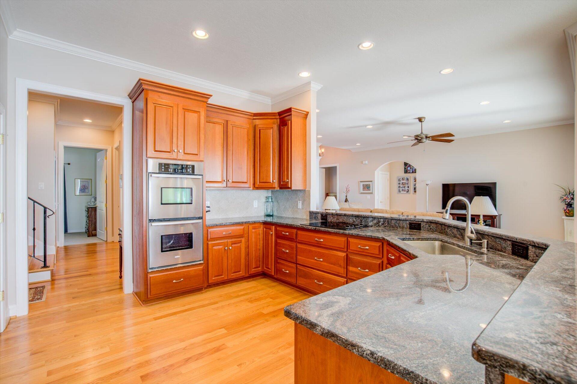 249 Pine Bay Drive Union Hall, VA 24176 - Photo 20 of 62 a kitchen with stainless steel appliances granite countertop a sink and dishwasher a stove with wooden floors