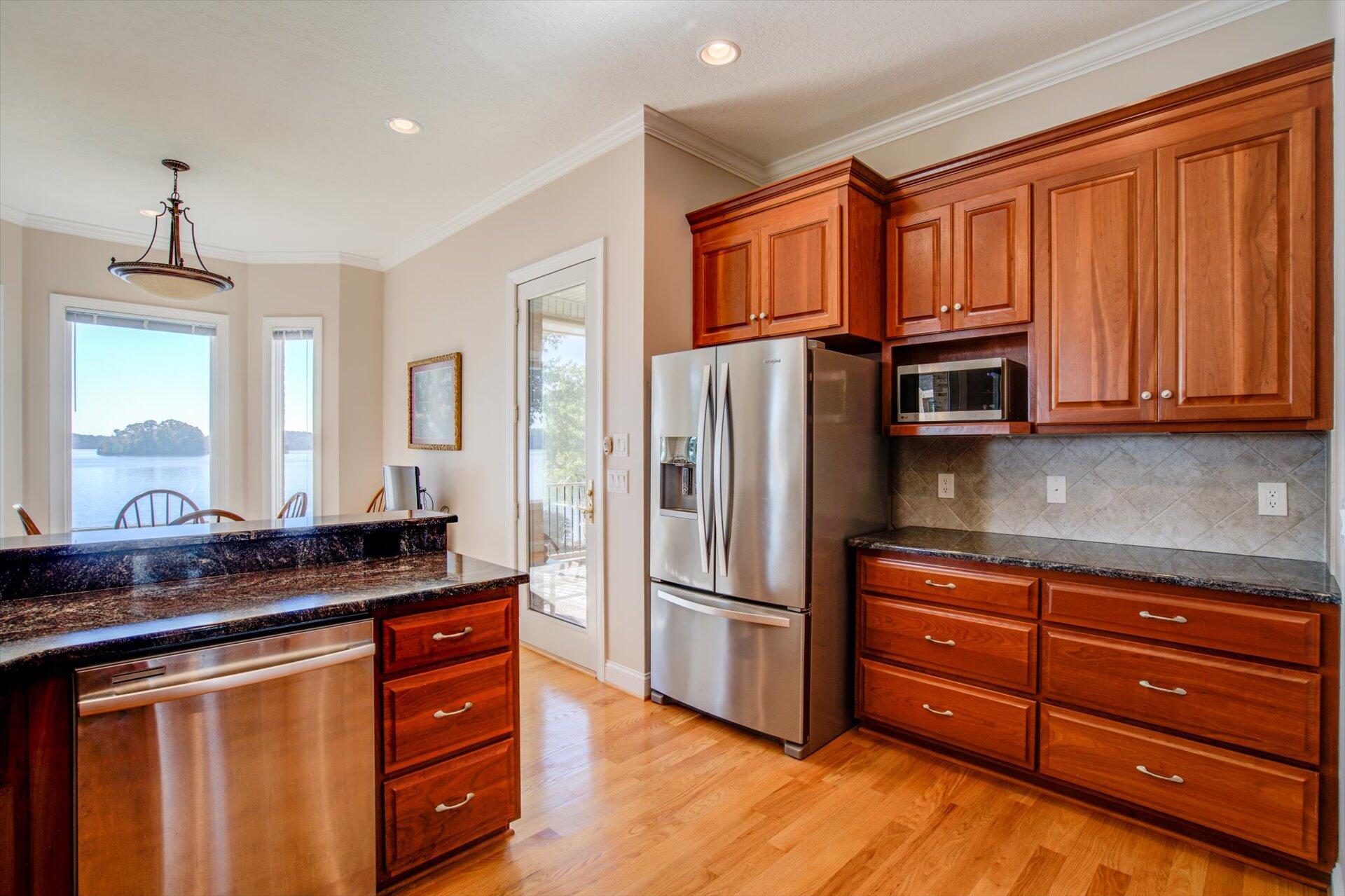 249 Pine Bay Drive Union Hall, VA 24176 - Photo 22 of 62 a kitchen with granite countertop stainless steel appliances and wooden cabinets