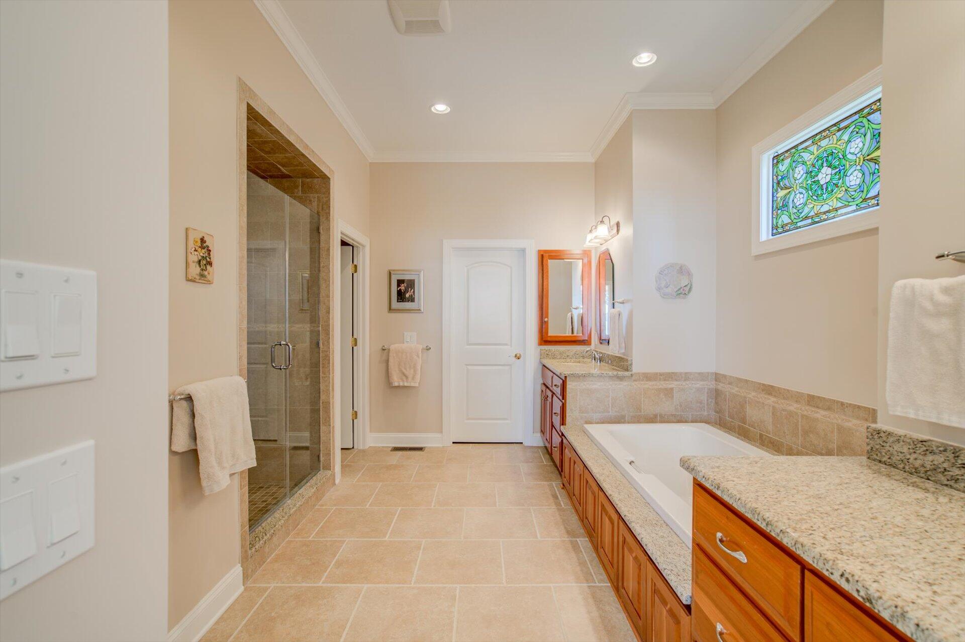 249 Pine Bay Drive Union Hall, VA 24176 - Photo 27 of 62 a spacious bathroom with a granite countertop tub sink and mirror