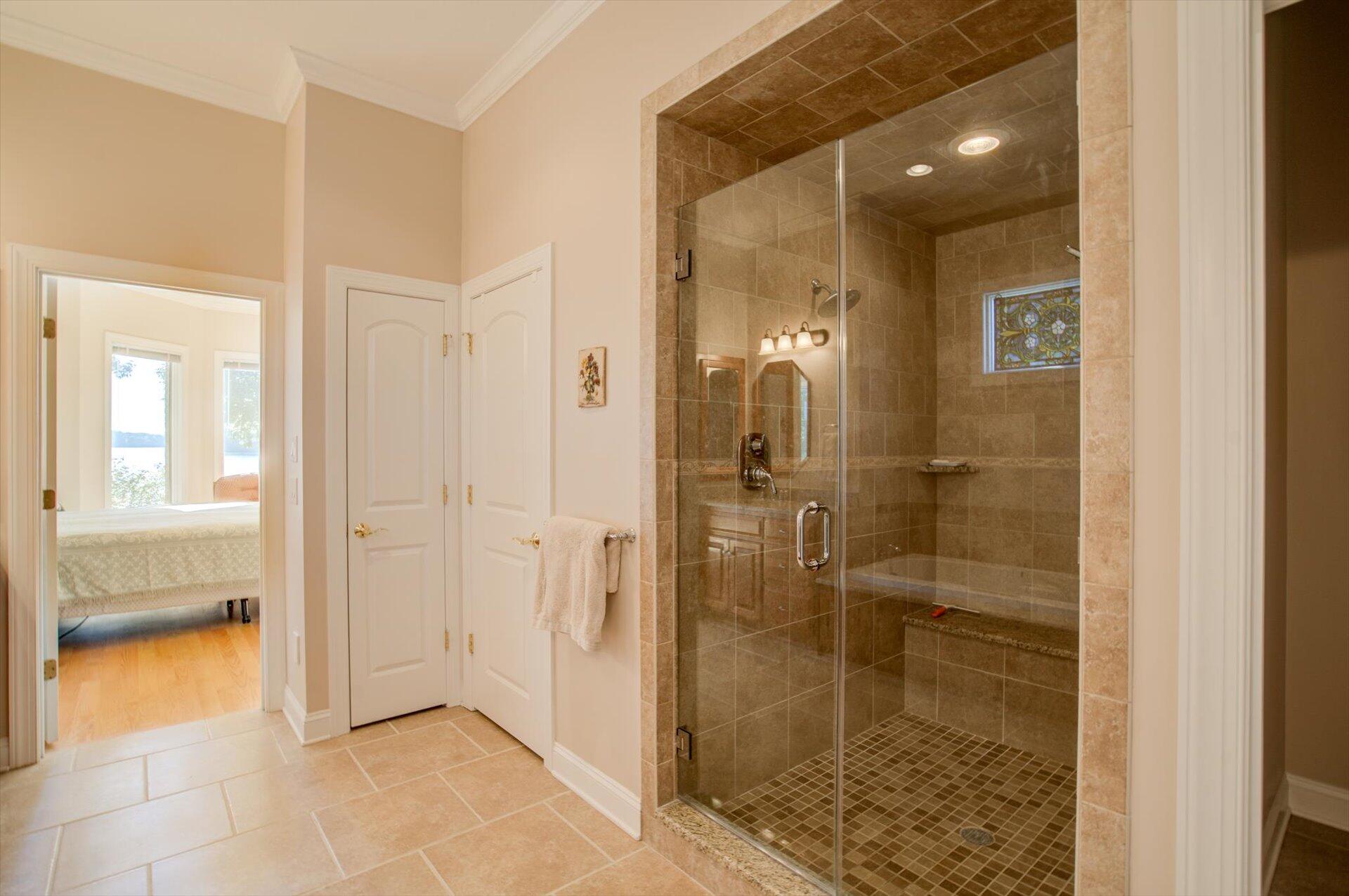 249 Pine Bay Drive Union Hall, VA 24176 - Photo 29 of 62 a bathroom with a glass shower door