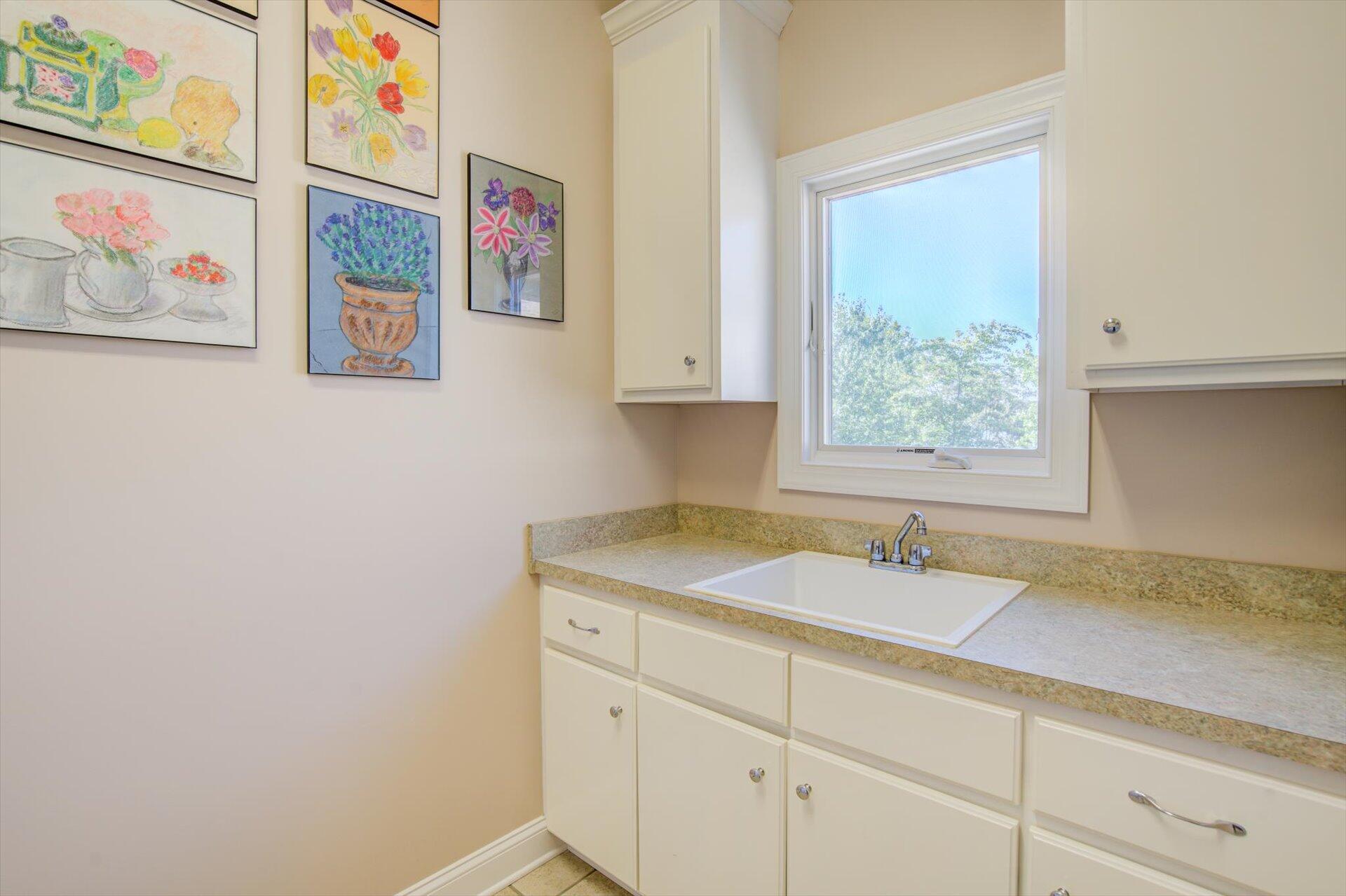 249 Pine Bay Drive Union Hall, VA 24176 - Photo 34 of 62 a bathroom with a granite countertop sink a mirror and a window