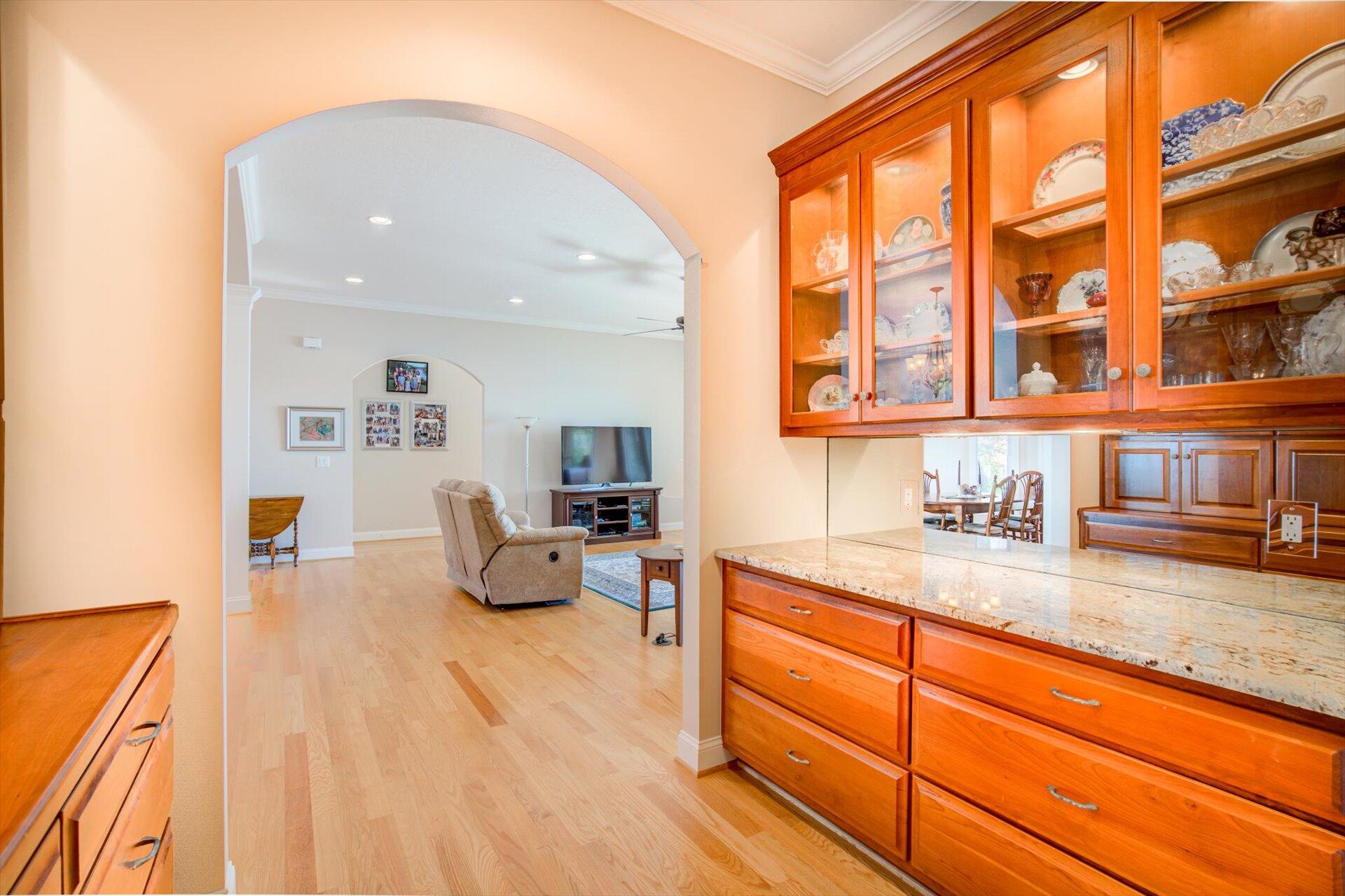 249 Pine Bay Drive Union Hall, VA 24176 - Photo 36 of 62 a kitchen with granite countertop a sink and white cabinets next to a window