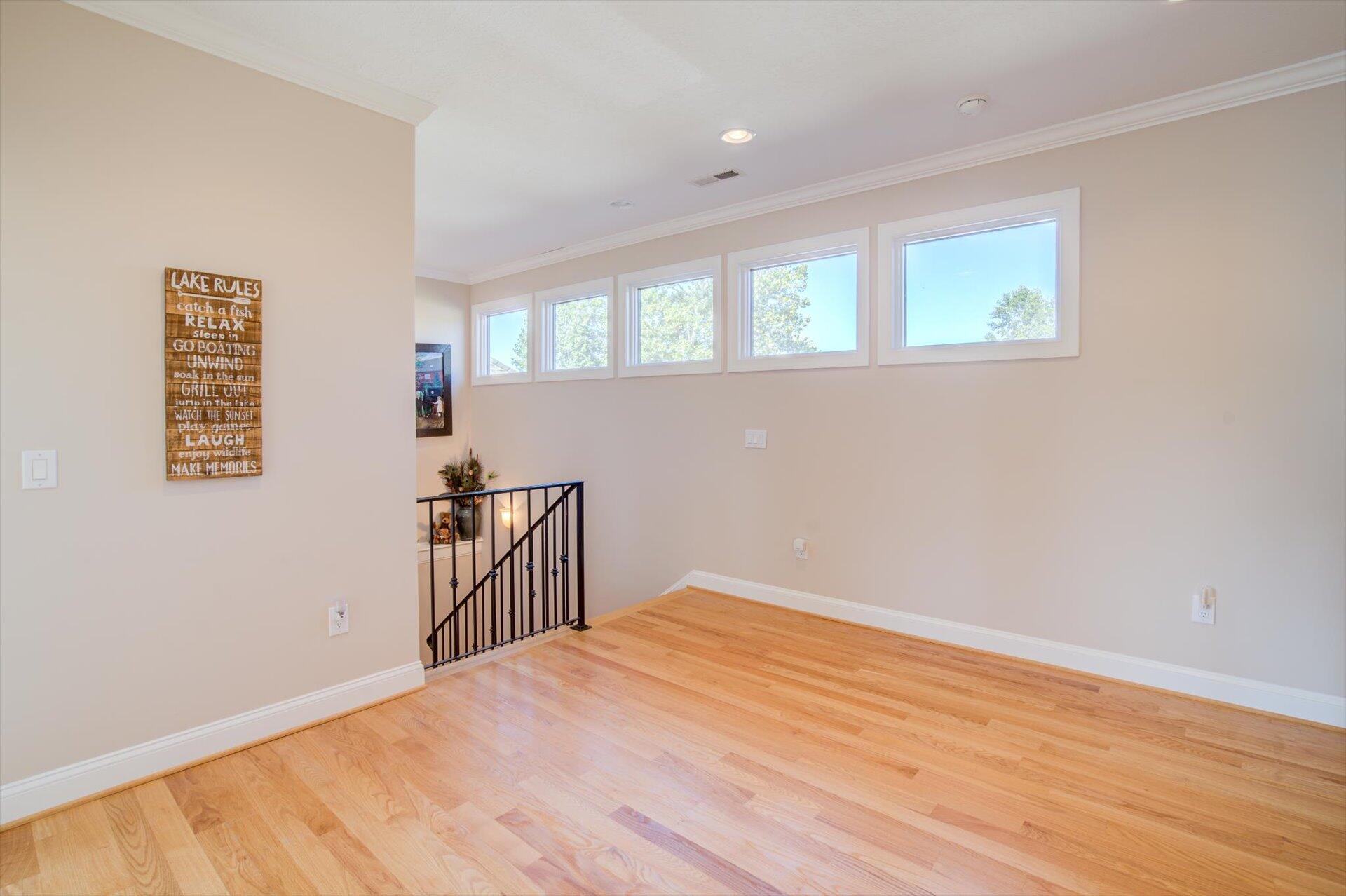 249 Pine Bay Drive Union Hall, VA 24176 - Photo 37 of 62 a big room with wooden floor and windows