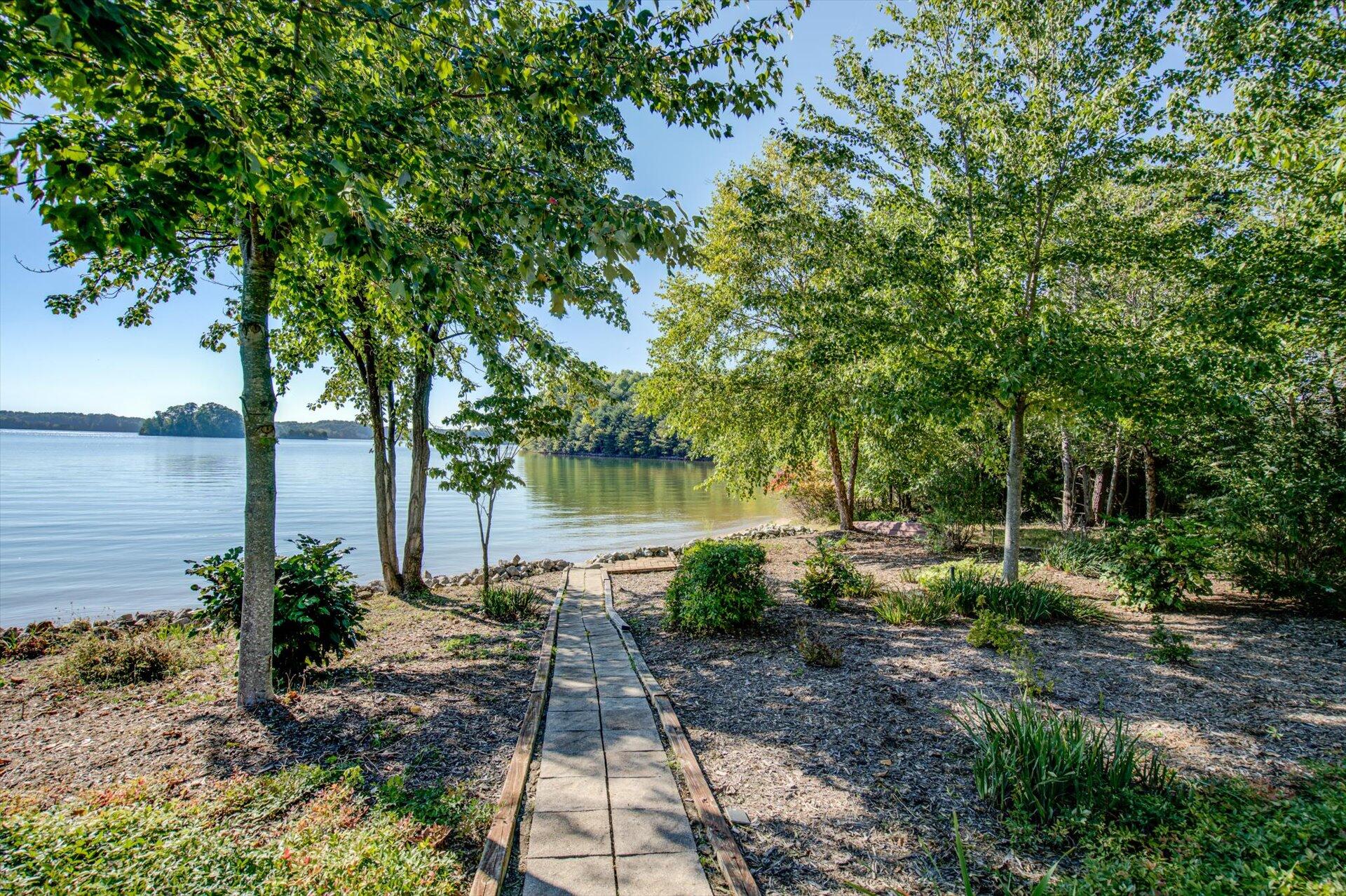 249 Pine Bay Drive Union Hall, VA 24176 - Photo 56 of 62 a backyard of a house with lots of green space and fountain