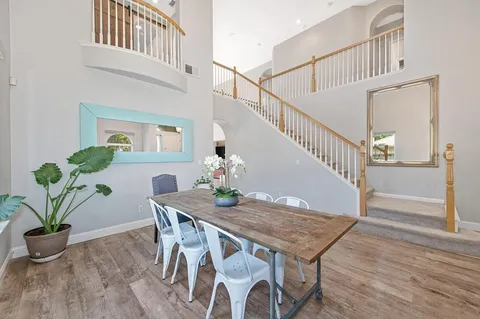a view of a livingroom with furniture and wooden floor