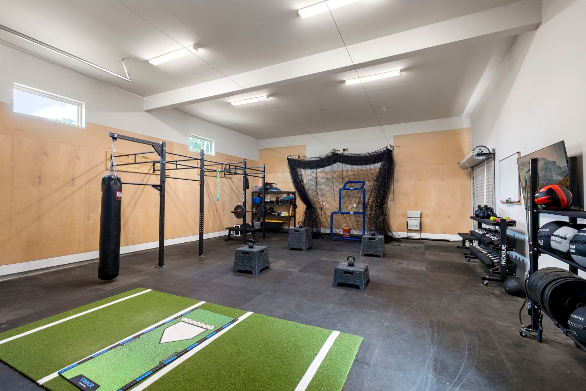 27318 Blue Cedar Lane Spring, TX 77386 - Photo 40 of 45 Detached garage with high ceilings, bright lighting, and durable flooring for endless possibilities.