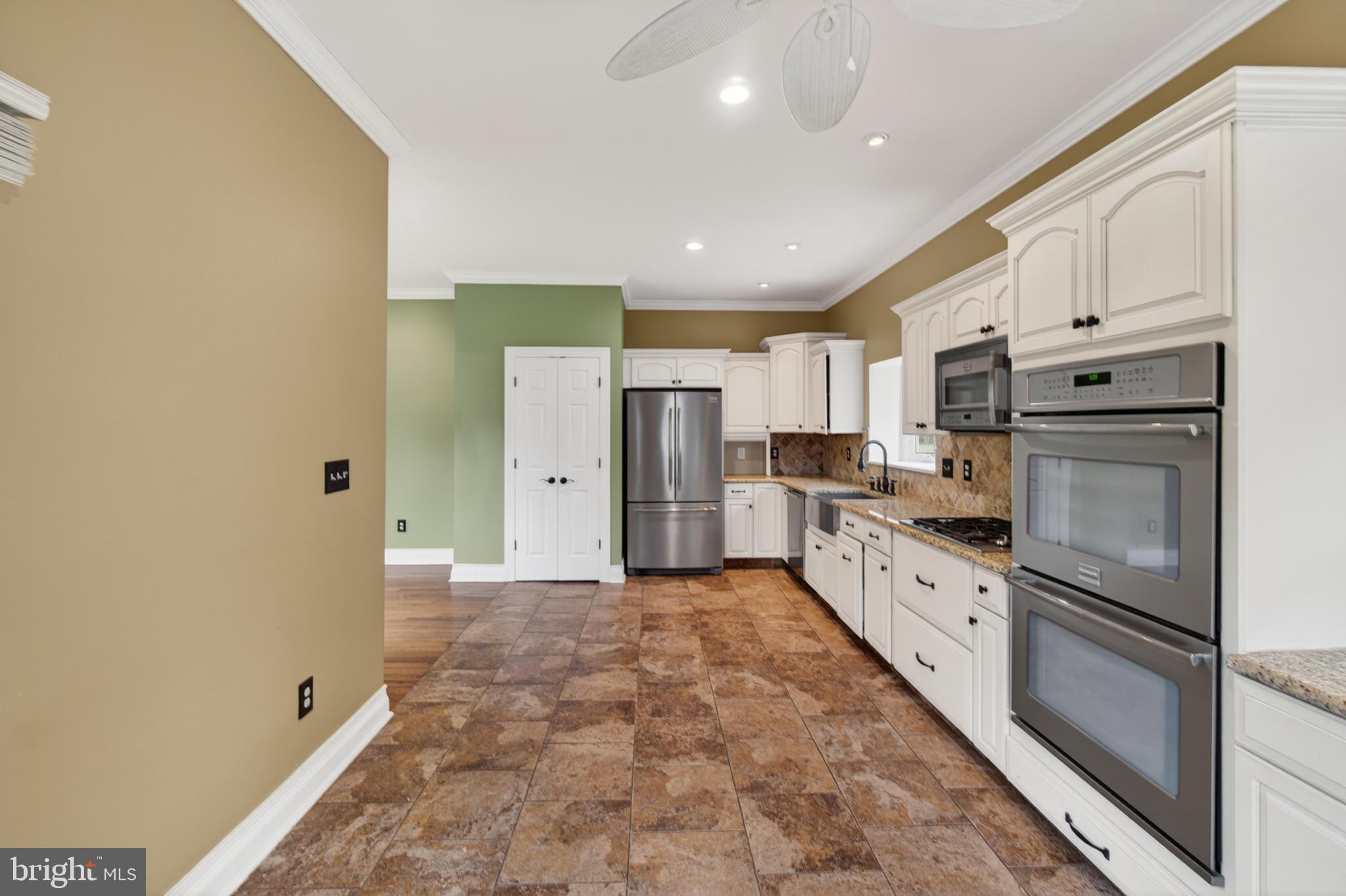 117 State Avenue Lindenwold, NJ 08021 - Photo 23 of 58 a kitchen with cabinets and stainless steel appliances