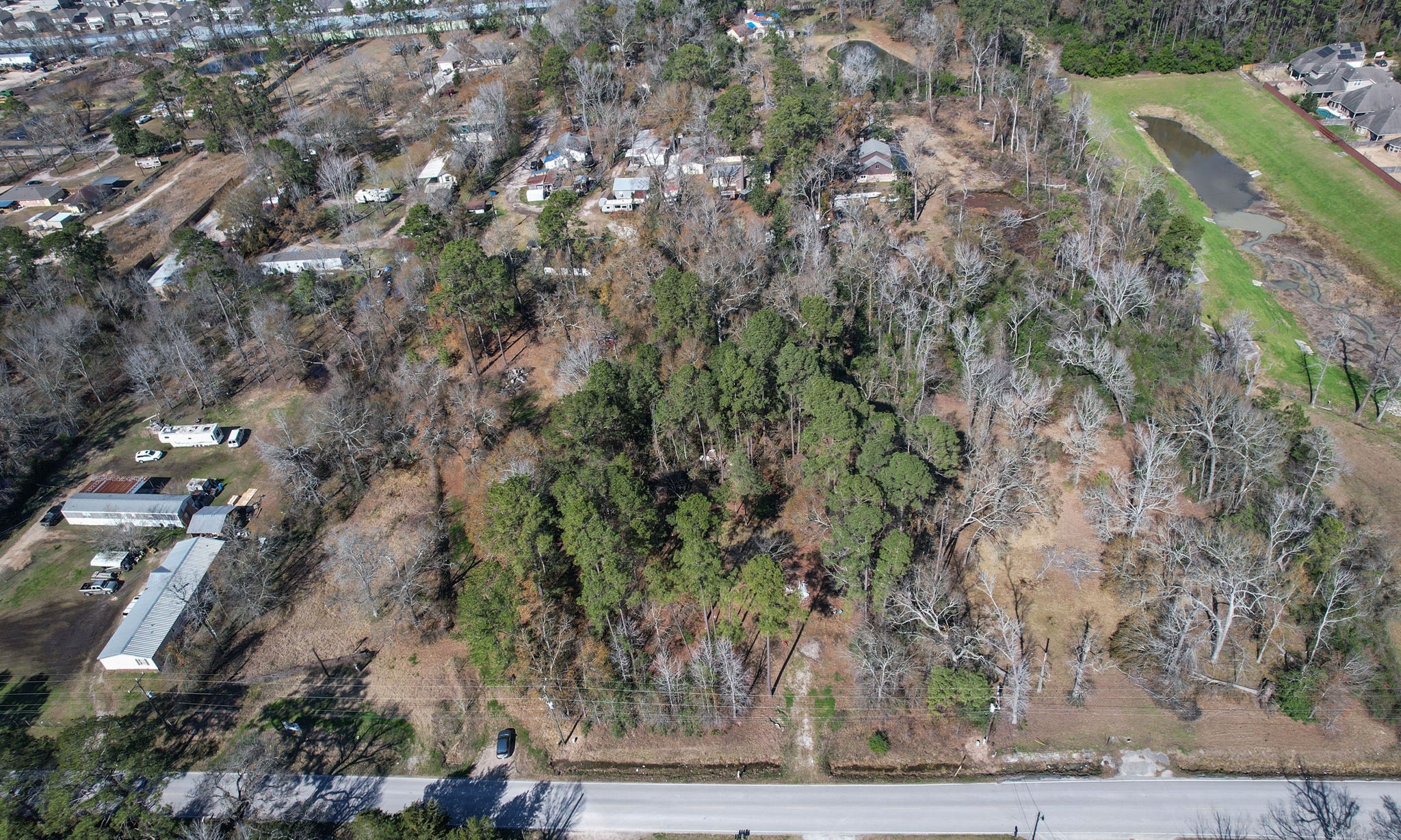 22475-22463 Adams Street Porter, TX 77365 - Photo 11 of 18 a view of a yard with plants