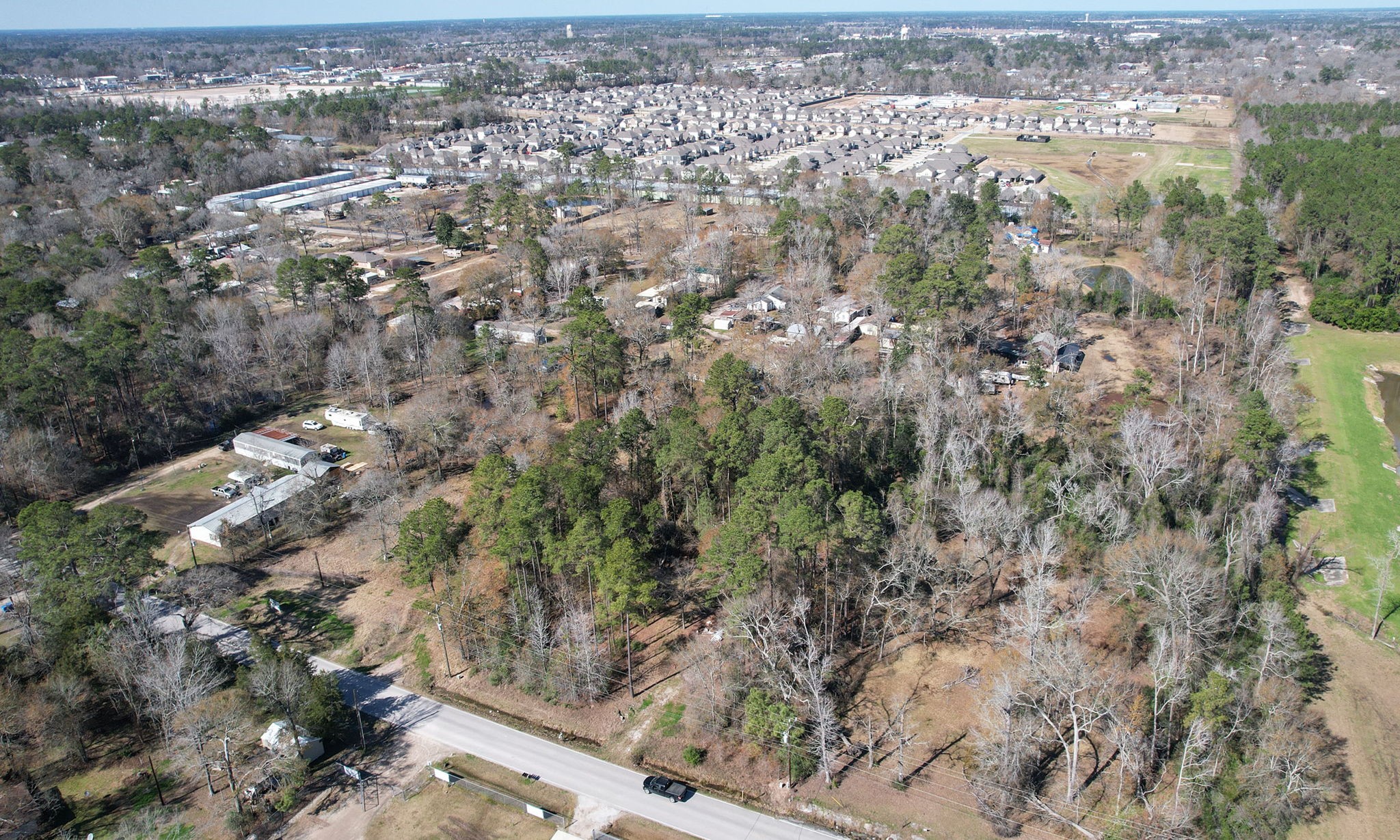 22475-22463 Adams Street Porter, TX 77365 - Photo 16 of 18 an aerial view of residential house with parking space