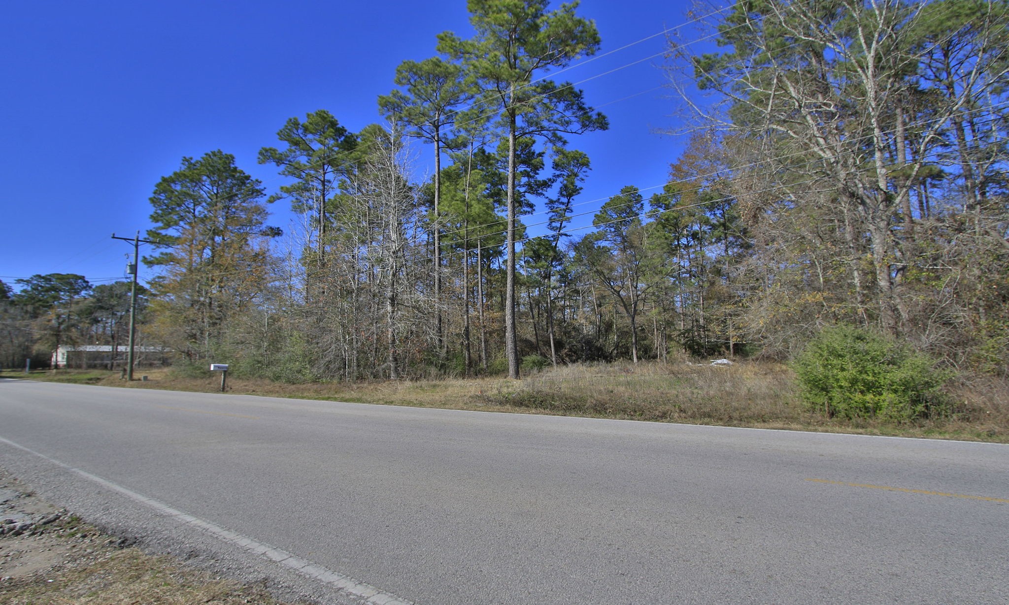 22475-22463 Adams Street Porter, TX 77365 - Photo 5 of 18 a view of a road with a building in the background